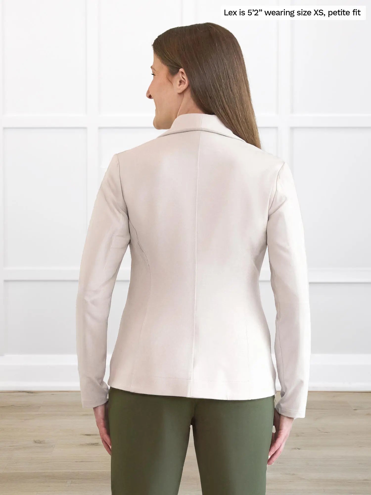 Miik model Lex (5’2”, small) standing with her back towards the camera showing the back of Miik&