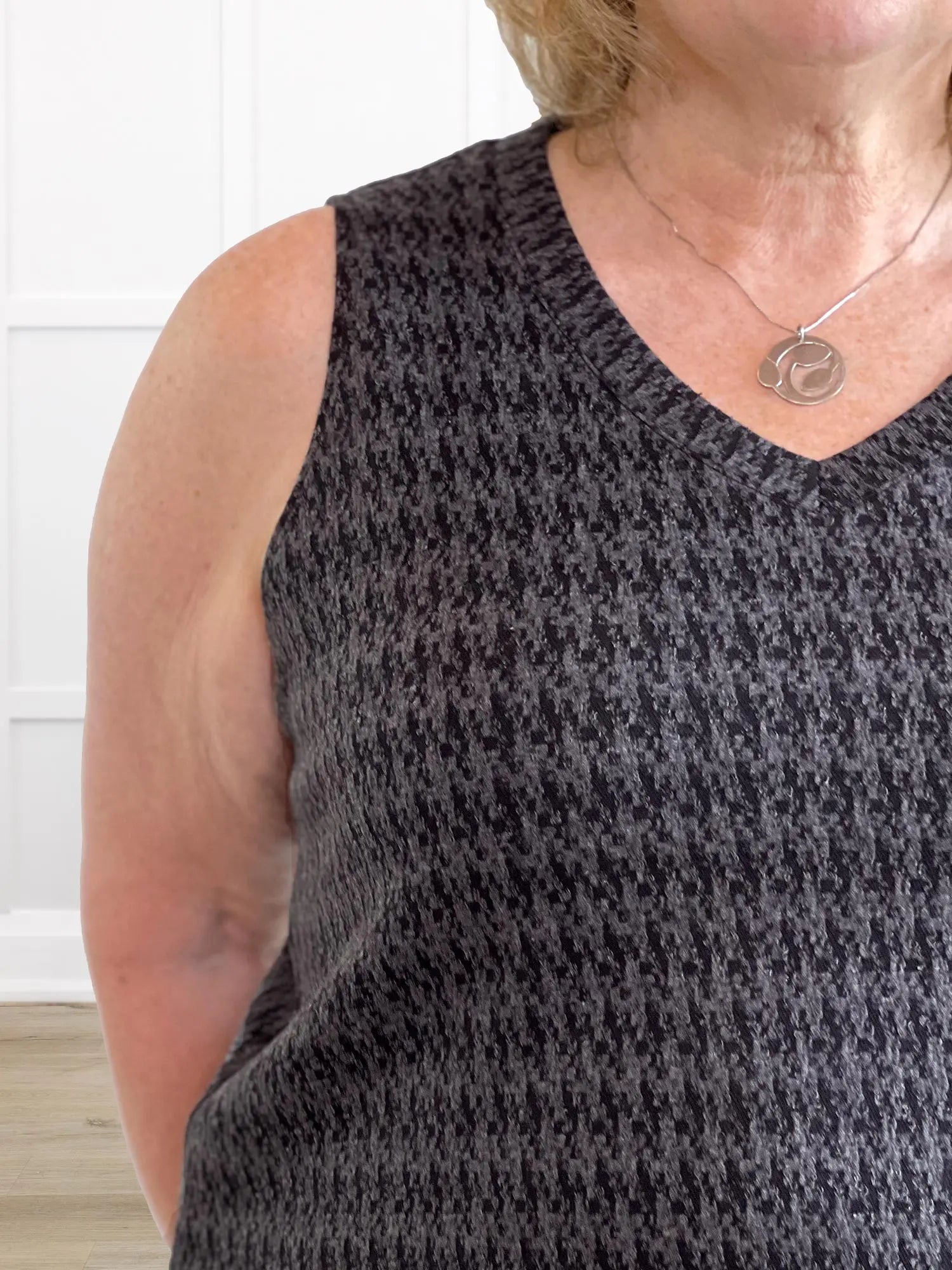 A closeup detail of the v-neck of Miik&