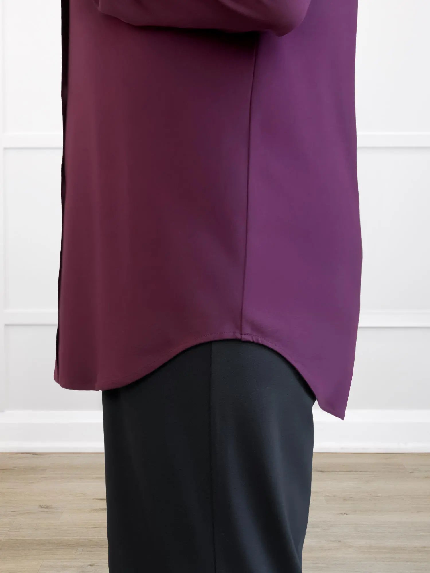 A closeup detail shot of the hemline of Miik&