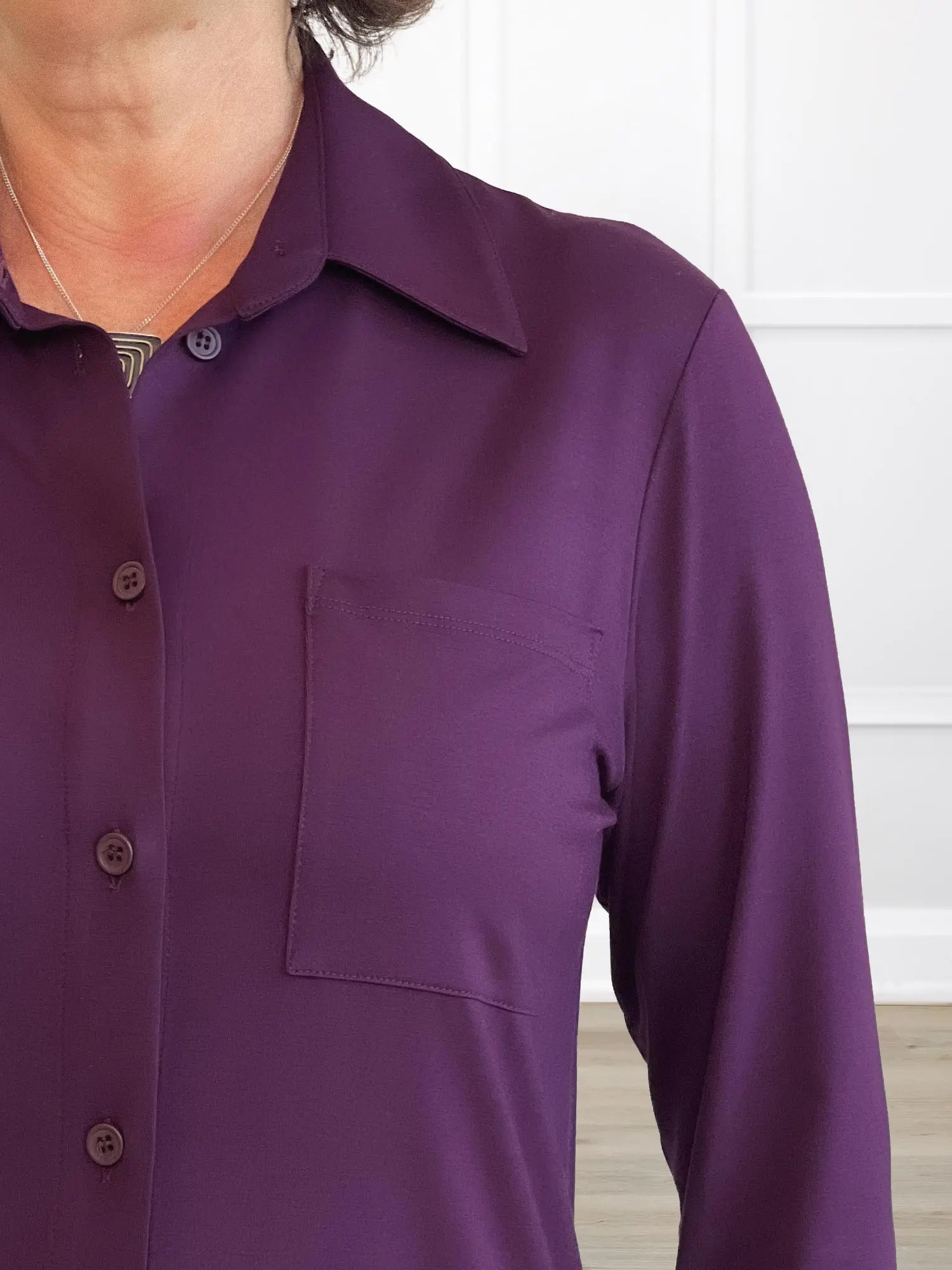 A closeup detail shot of the neckline of Miik&