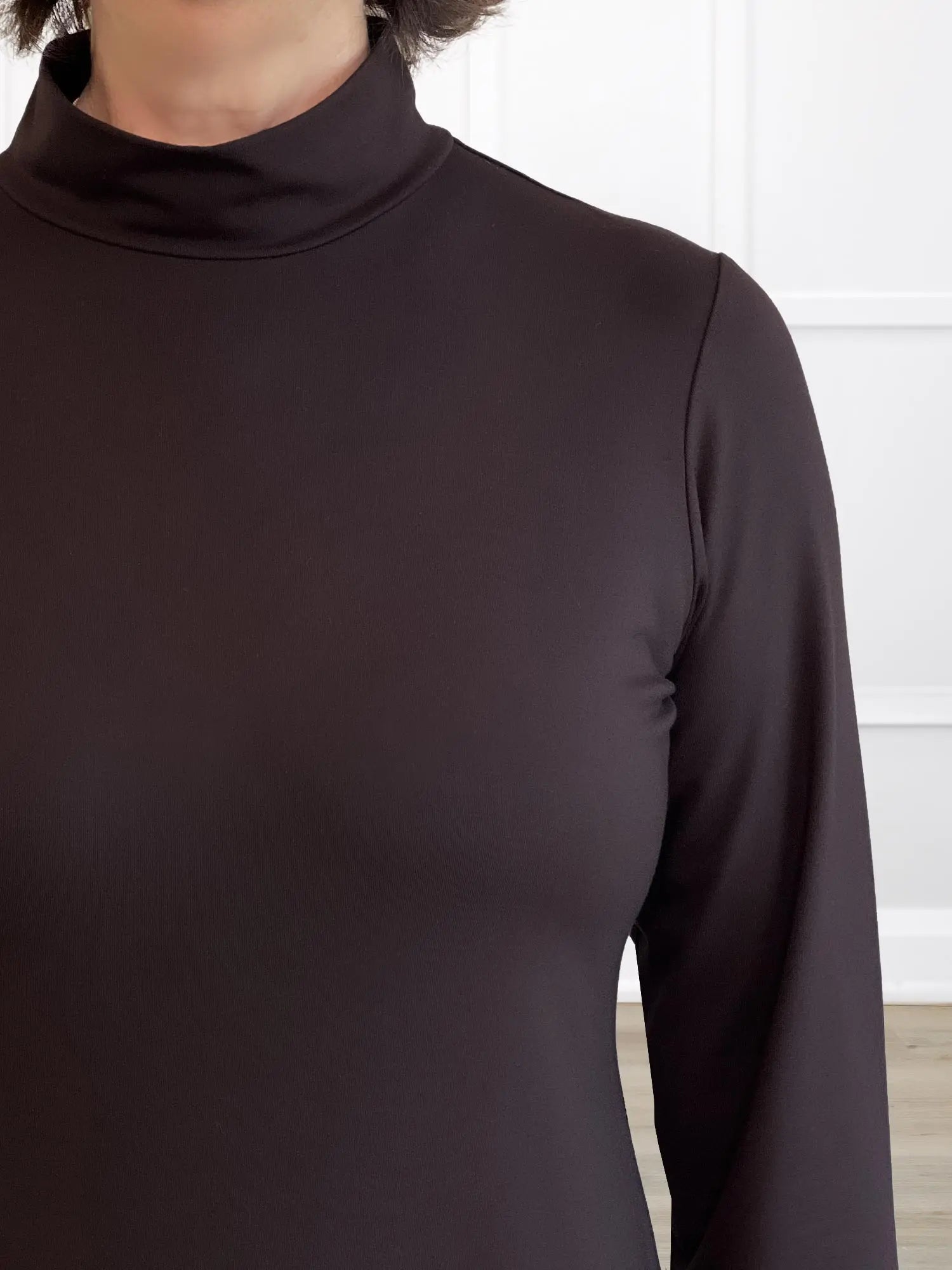 A closeup detail shot of the neckline of Miik&