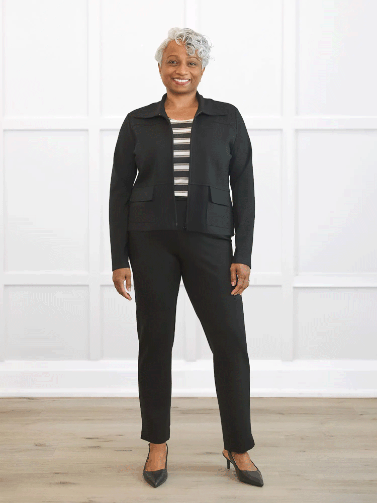 a woman wearing a black suit showing the jacket unzipped, half way zipped, and all the way zipped