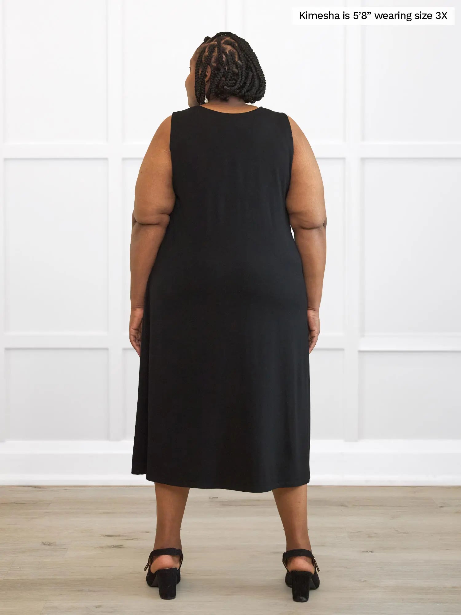 Miik model plus size Kimesha (5â8â, 3x) standing with her back towards the camera showing the back of Miik&