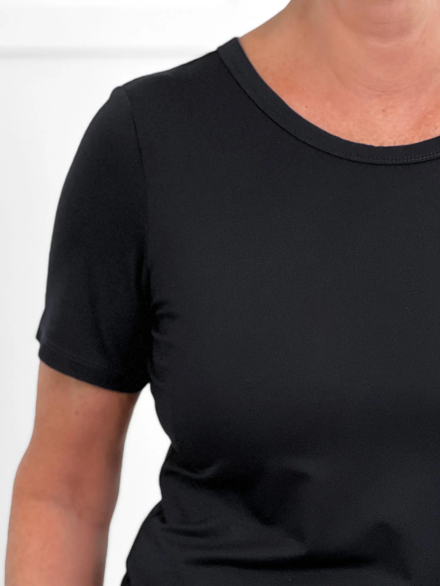 A closeup image showing the sleeve and crew-neckline of Marissa half sleeve tee.