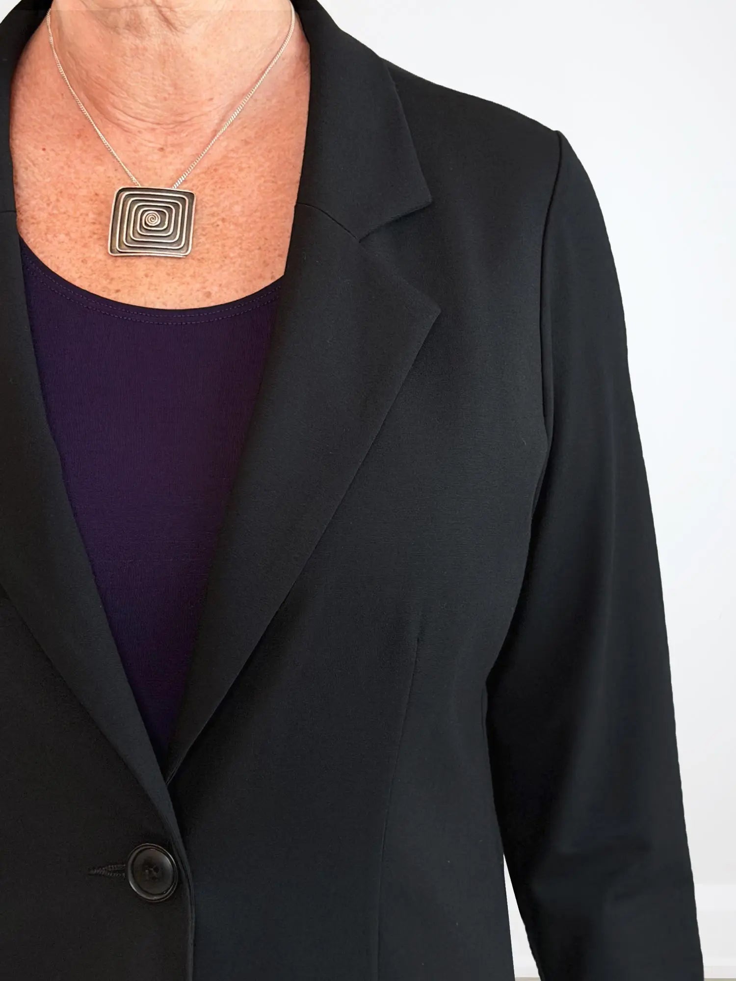 A closeup detail of the collar of Miik&