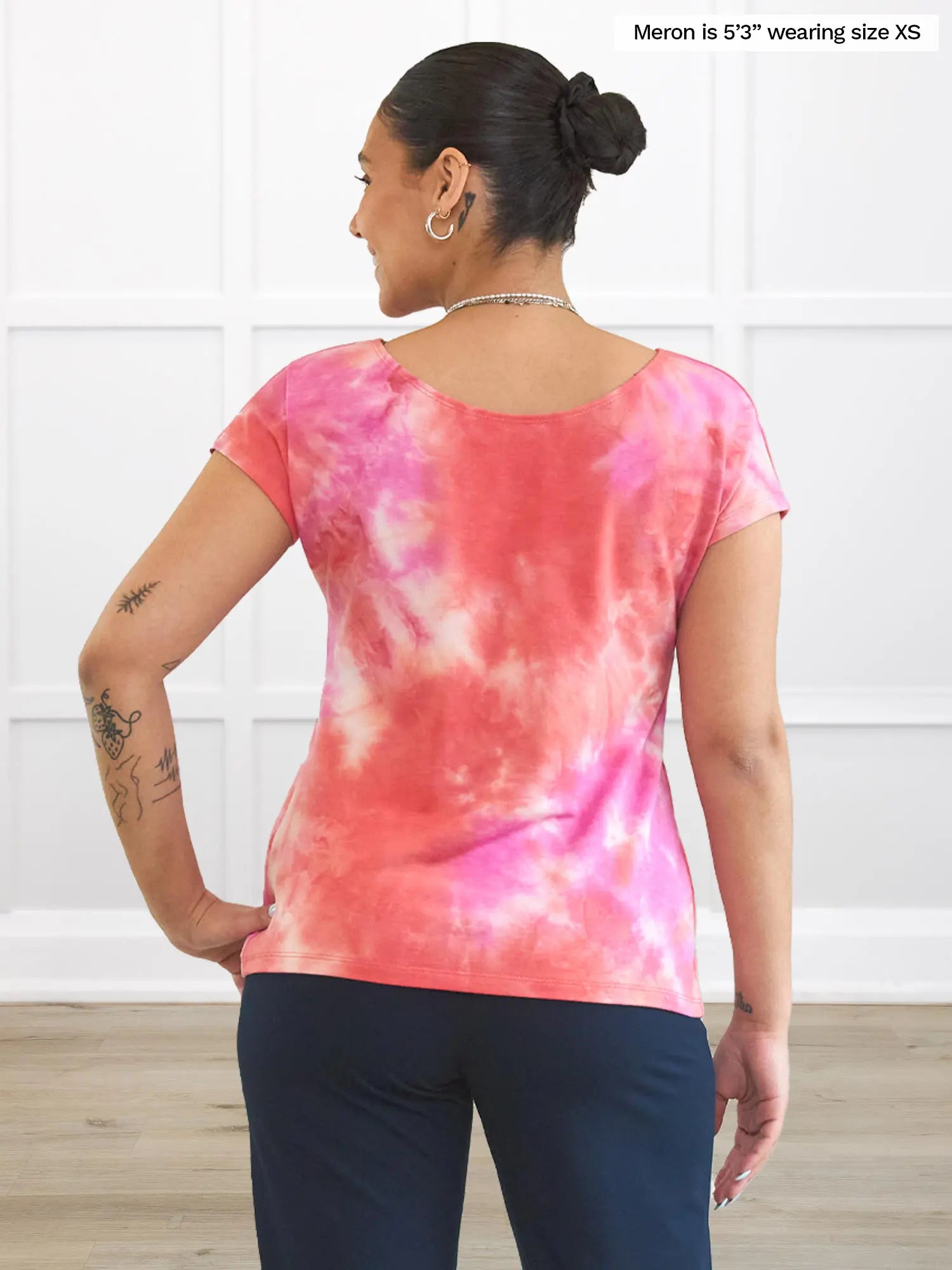 Miik model Meron (5’3”, xsmall) standing with her back towards the camera showing the back of Miik&