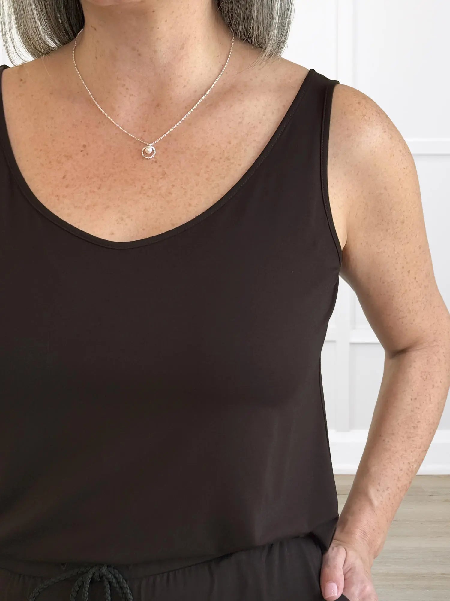 A closeup detail of the neckline of Miik&