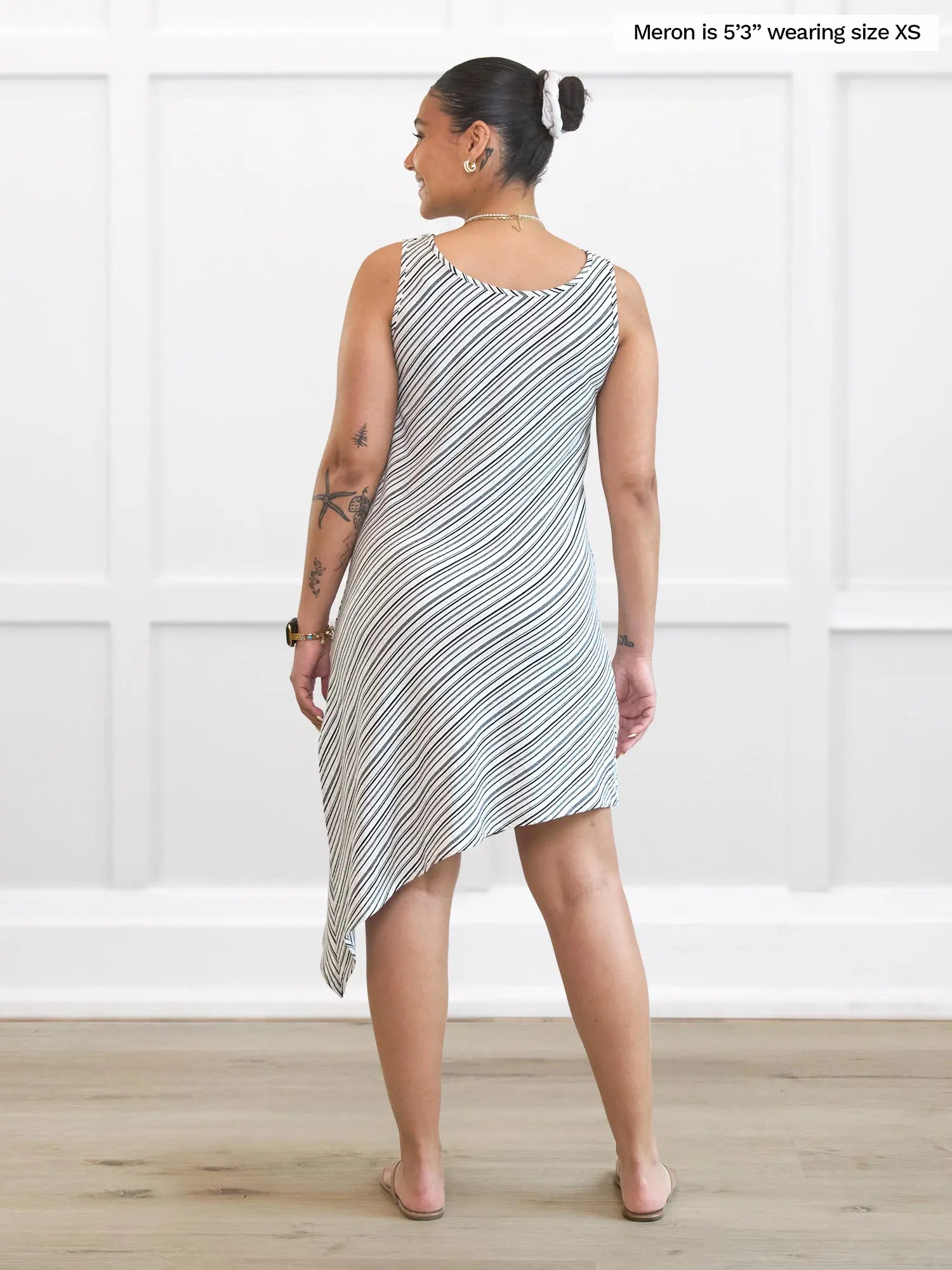 Miik model Meron (5’3”, xsmall) standing with her back towards the camera showing the back of Miik&