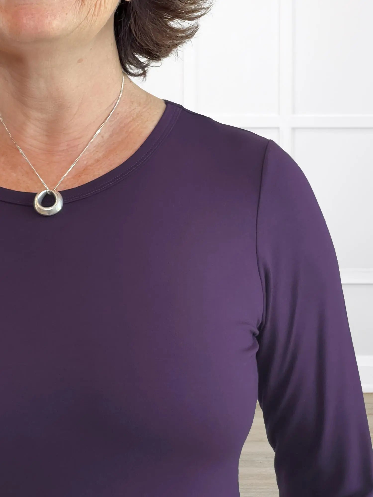 A closeup detail of the neckline of Miik&