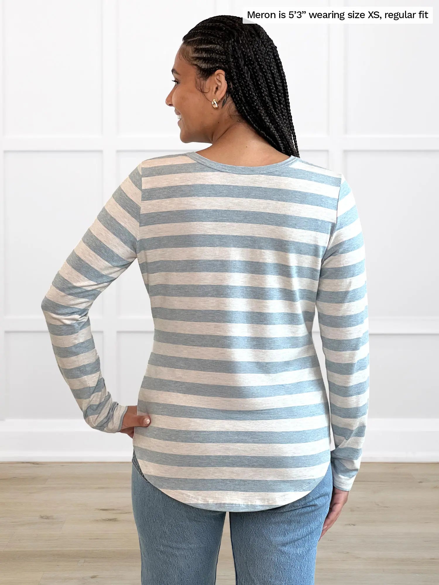 Miik model Meron (5’3”, xsmall) standing with her back towards the camera showing the back of Miik&