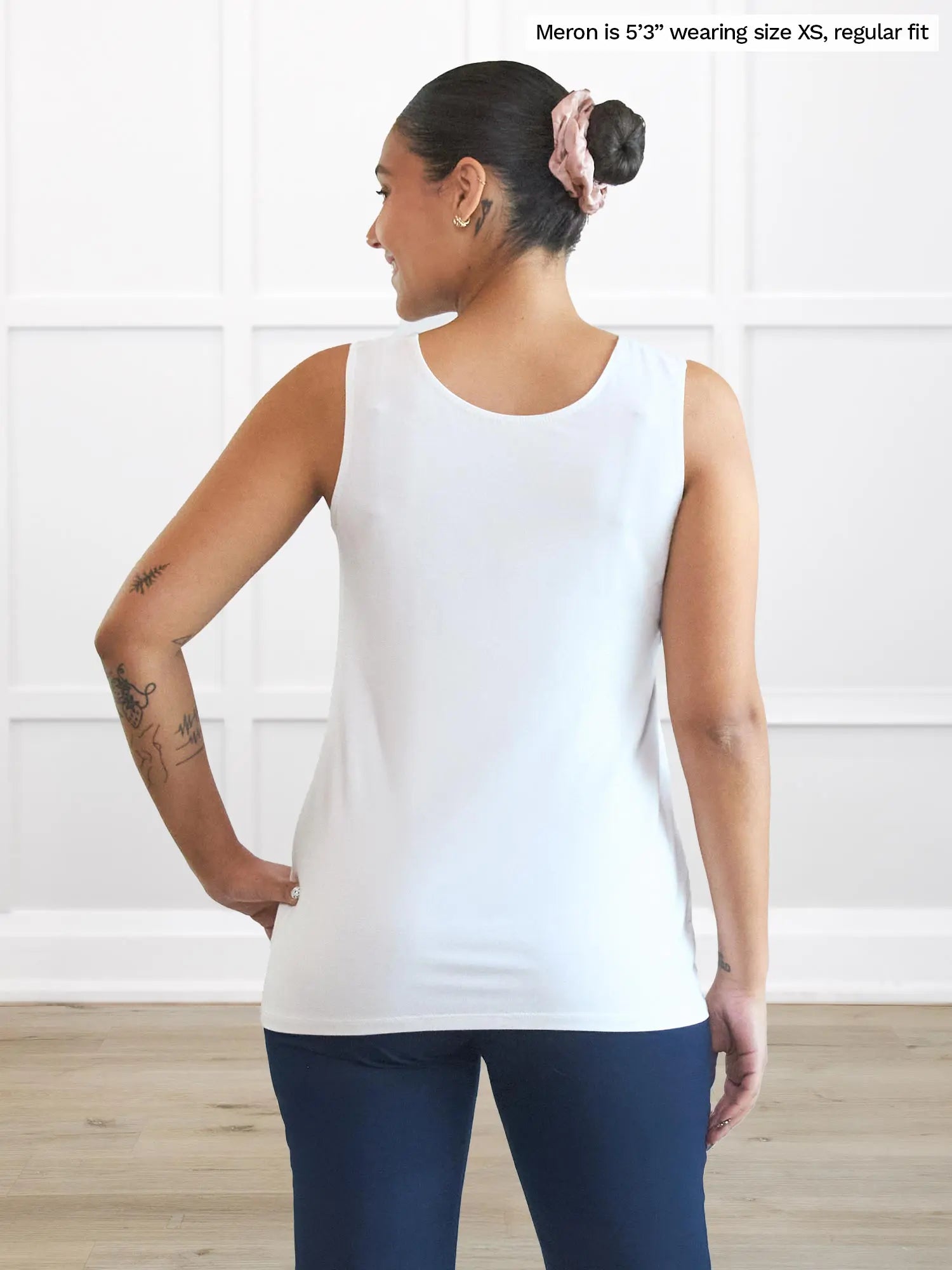 Miik model Meron (5’3”, xsmall) standing with her back towards the camera showing the back of Miik&