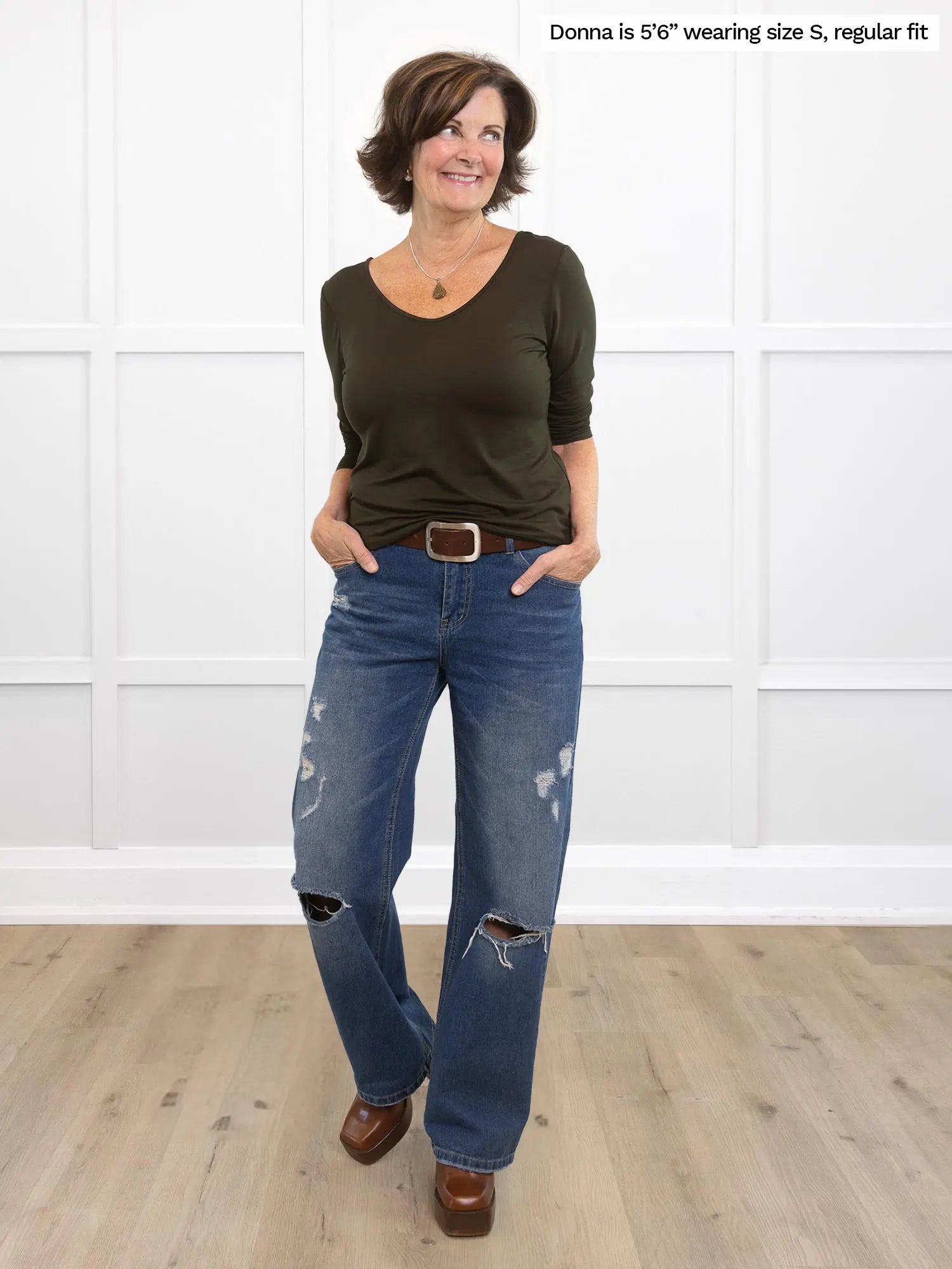 Miik founder Donna is wearing the Shannon reversible long sleeve t-shirt in olive green with belted blue jeans.