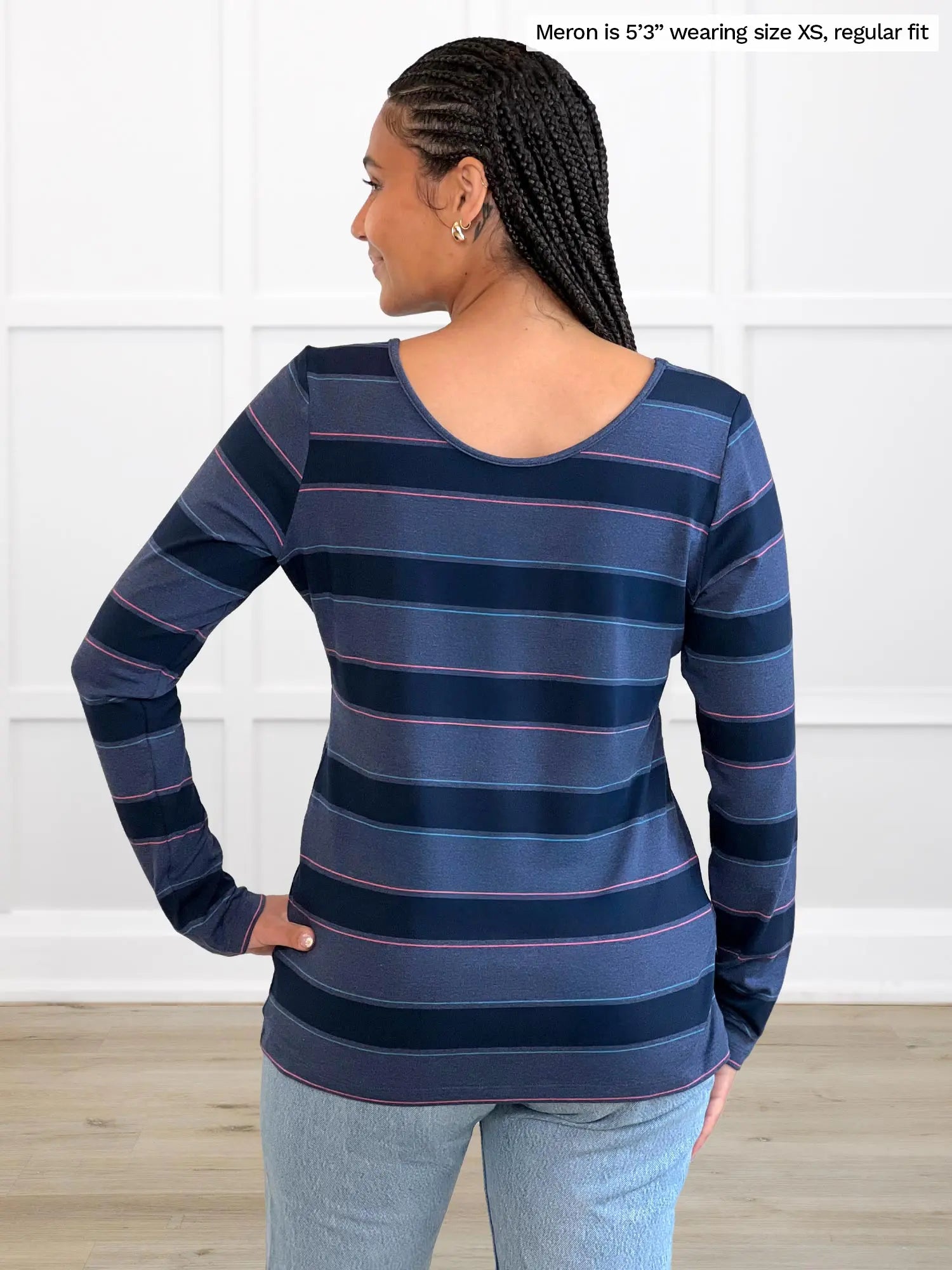 Miik model Meron (5’3”, xsmall) standing with her back towards the camera showing the back of Miik&