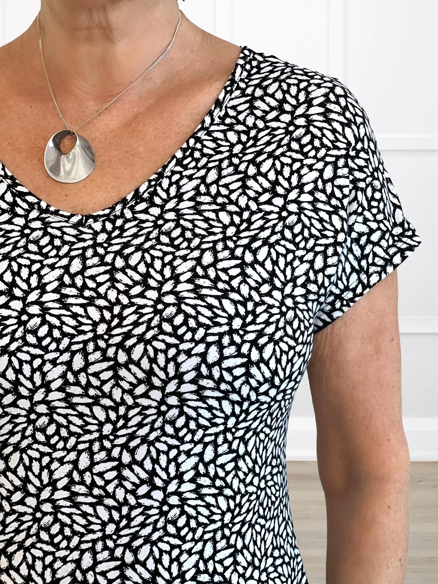 A closeup detail of the neckline of Miik&
