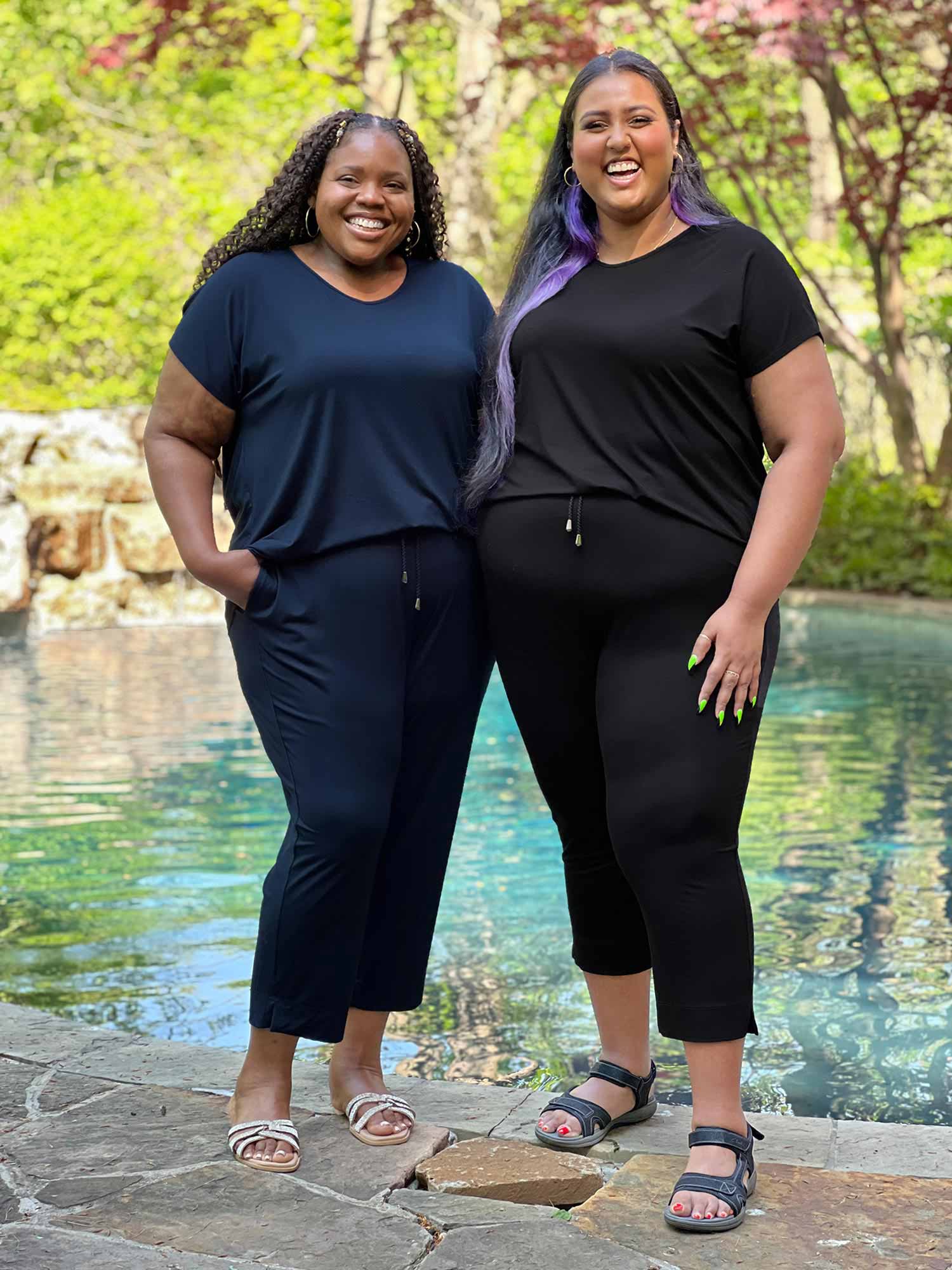 Miik models plus size Kimesha and Sureka smiling both wearing the same jumpsuit: Miik&
