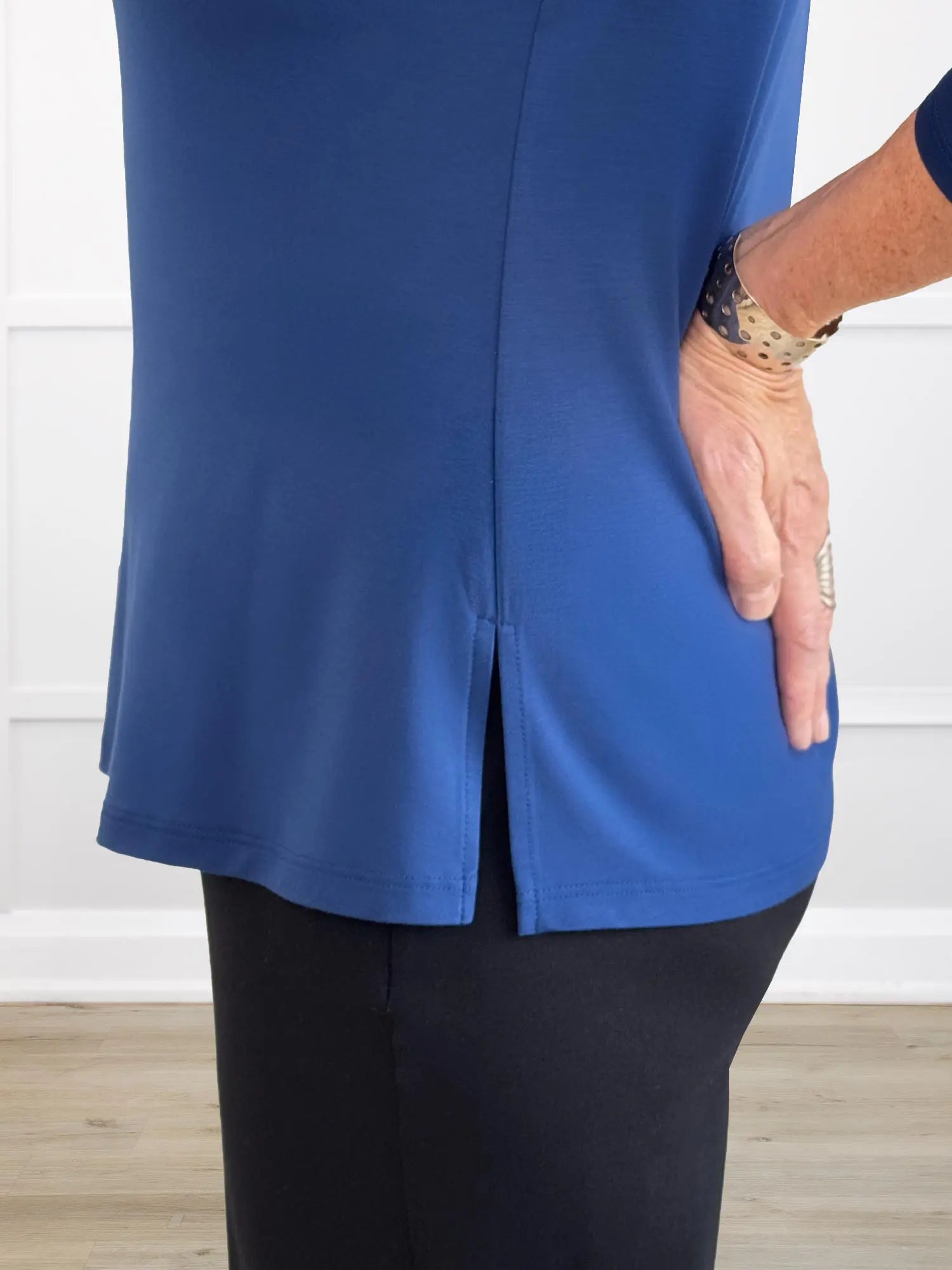 A closeup detail shot of the slit hem of Miik&