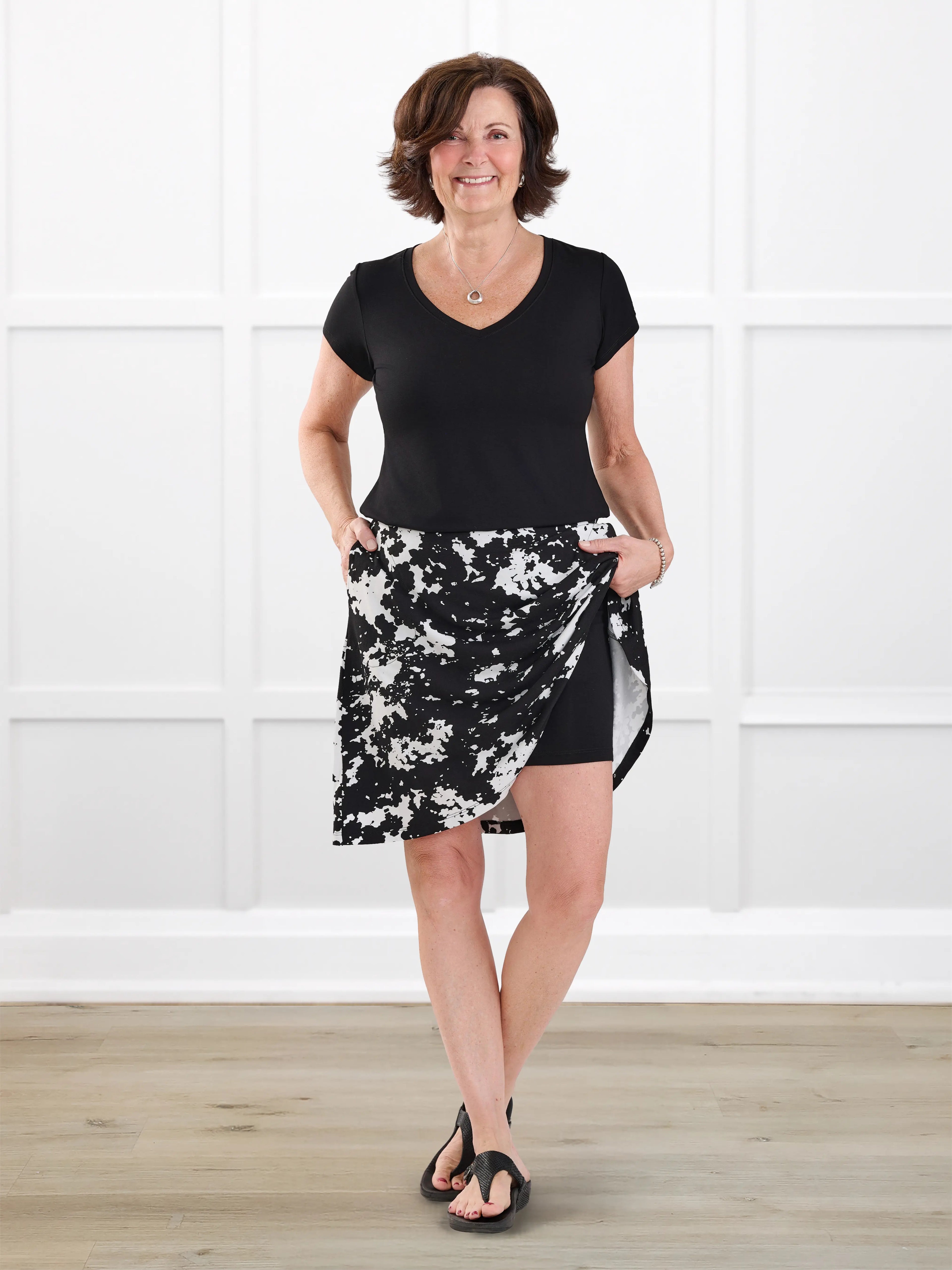 Adina flowy knee length pocket skort for women in Moo’d bloom on model Donna, size S @Donna-S
