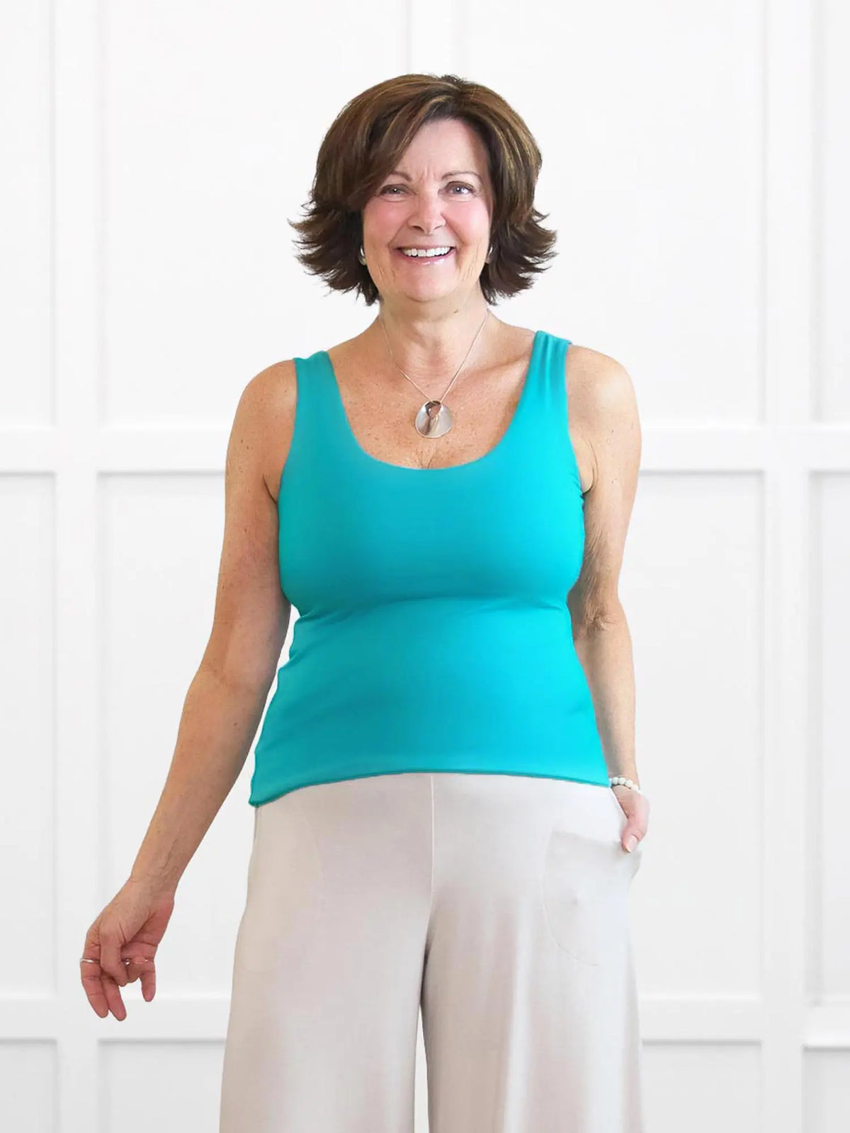 Amina reversible neckline shelf bra tank for women in Sea glass on model Donna, size S @Donna-S
