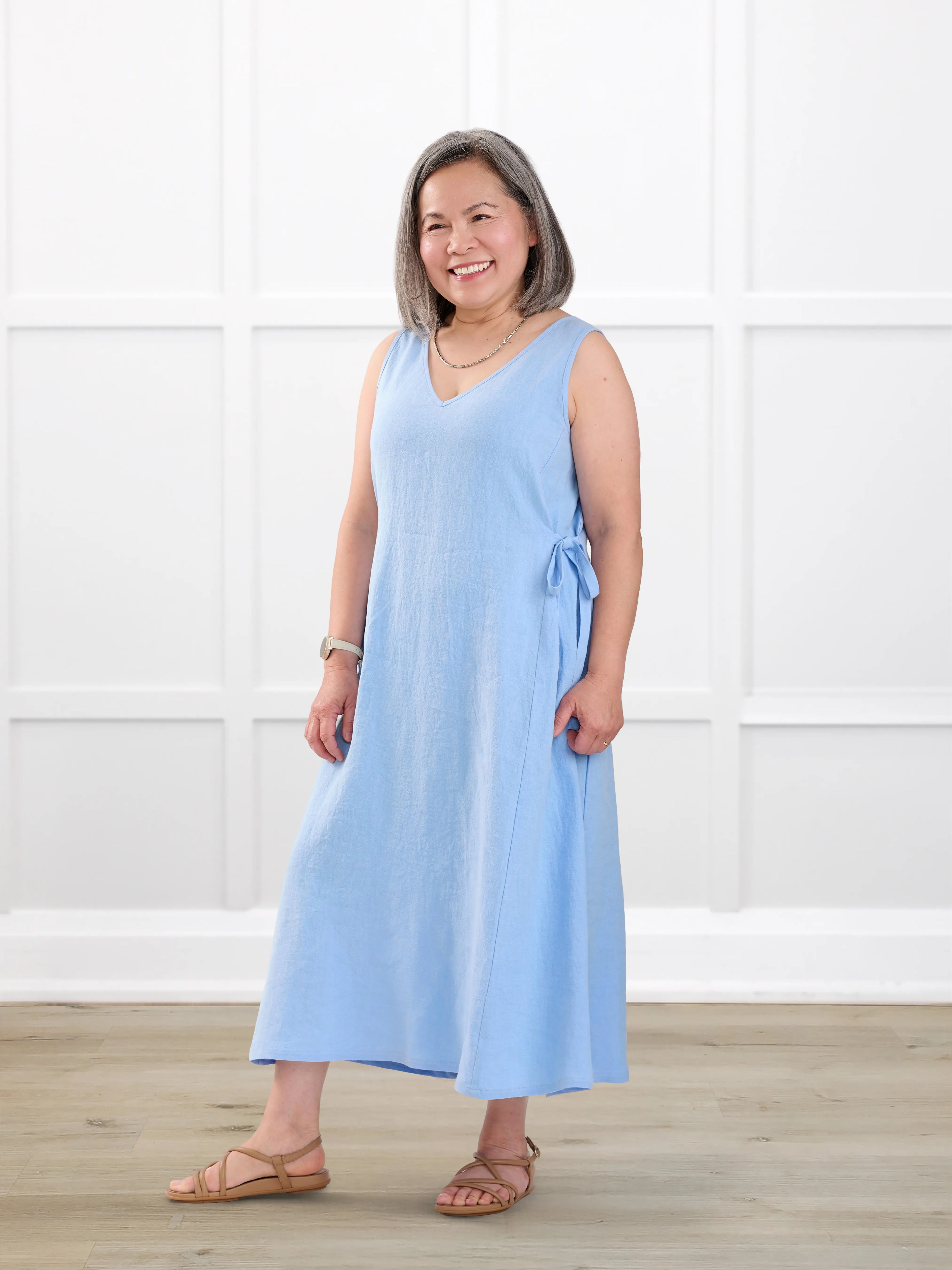 Delfina reversible neckline linen dress for women in Serene blue linen on model Terry, size XS @Terry-XS