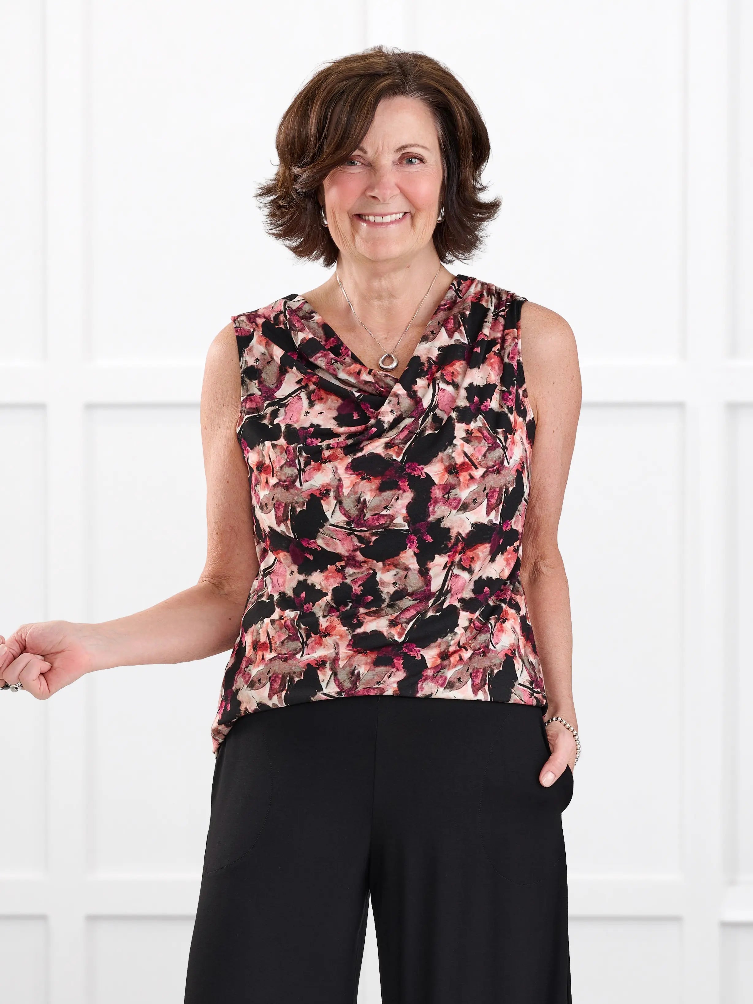 Dion sleeveless draped dressy top for women in Pink bouquet on model Donna, size S @Donna-S