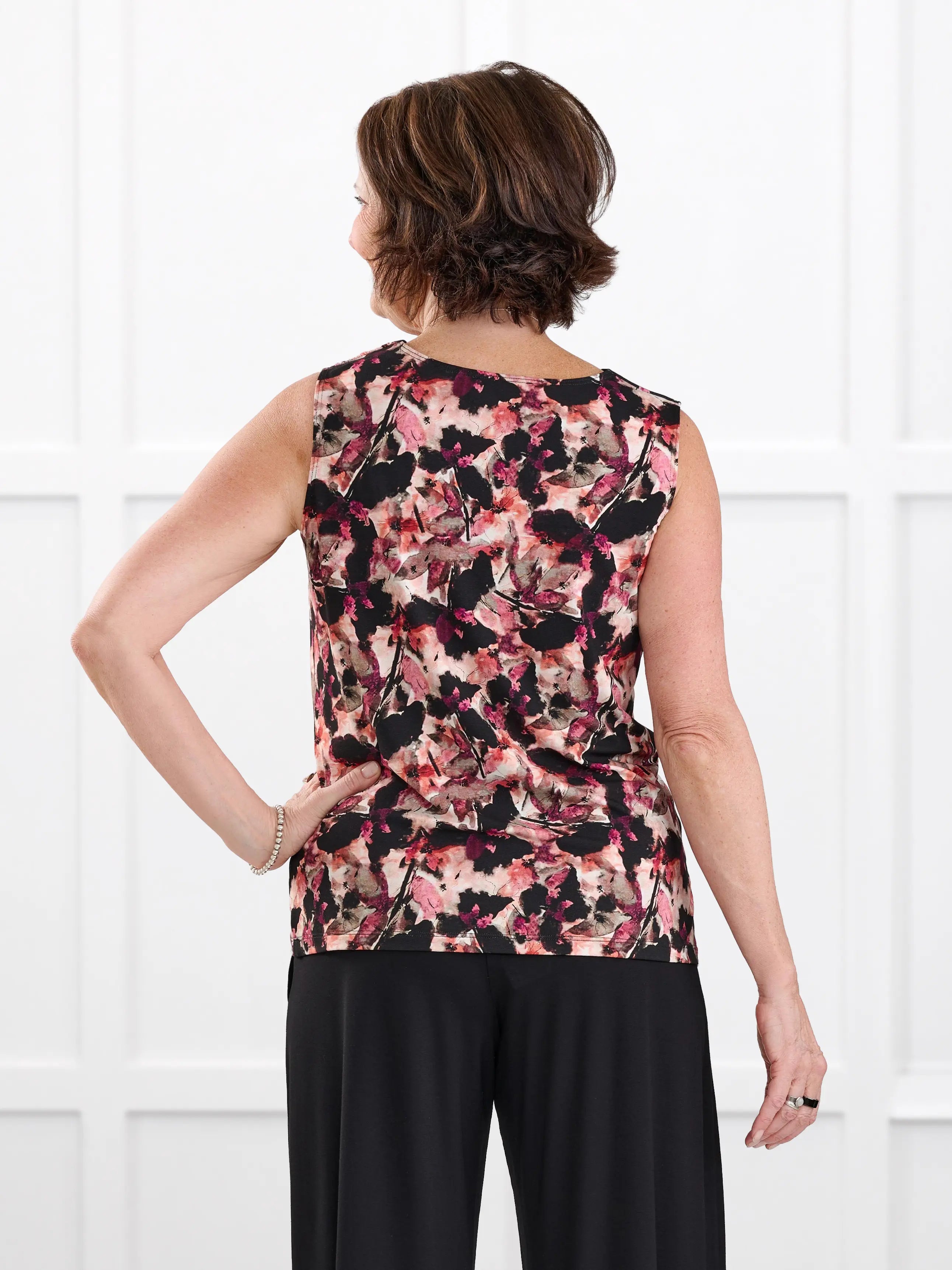 Dion sleeveless draped dressy top for women in Pink bouquet on model Donna, size S @Donna-S