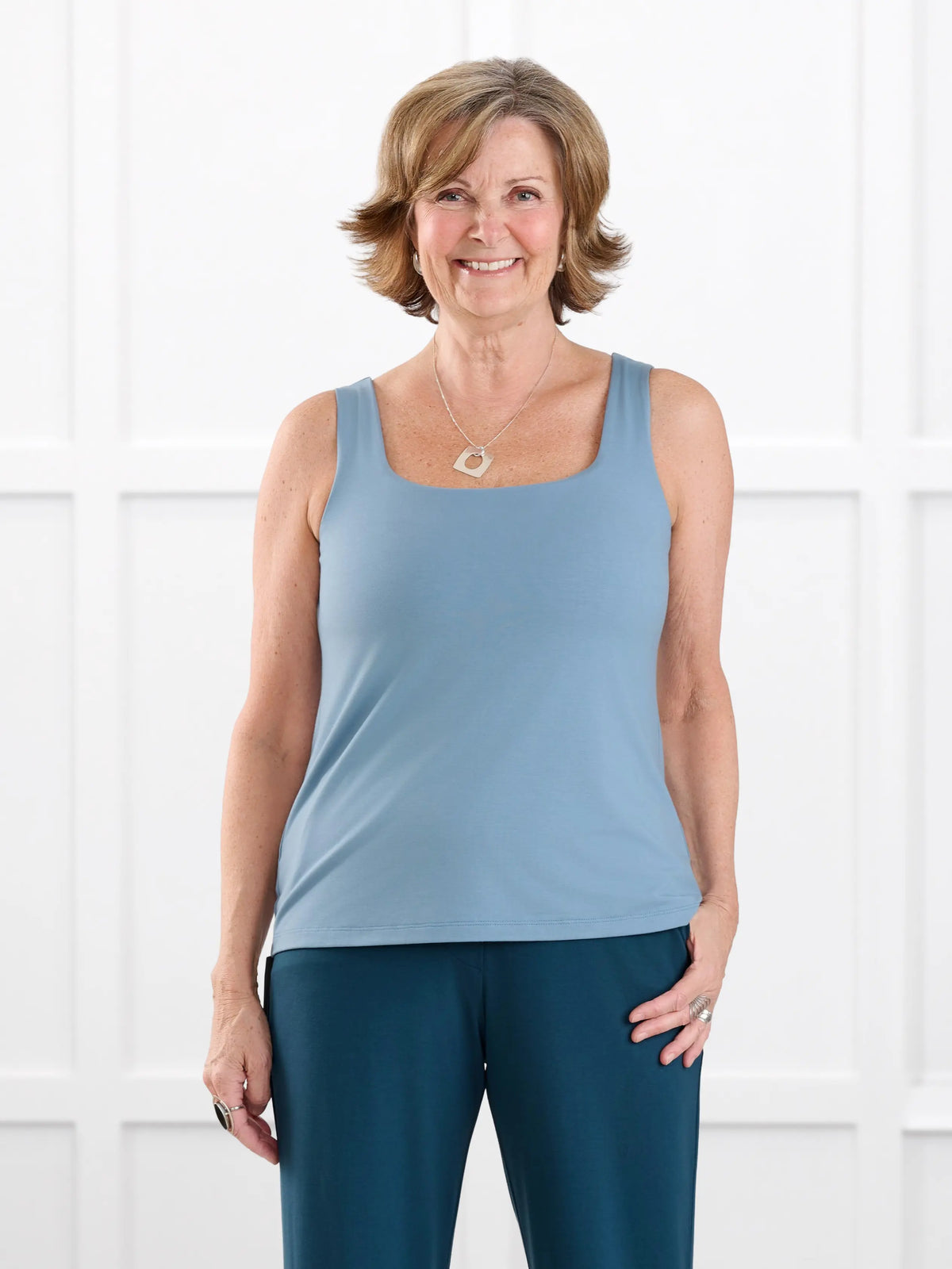 Eline reversible neckline shelf bra tank for women in Steel blue on model Donna, size S @Donna-S