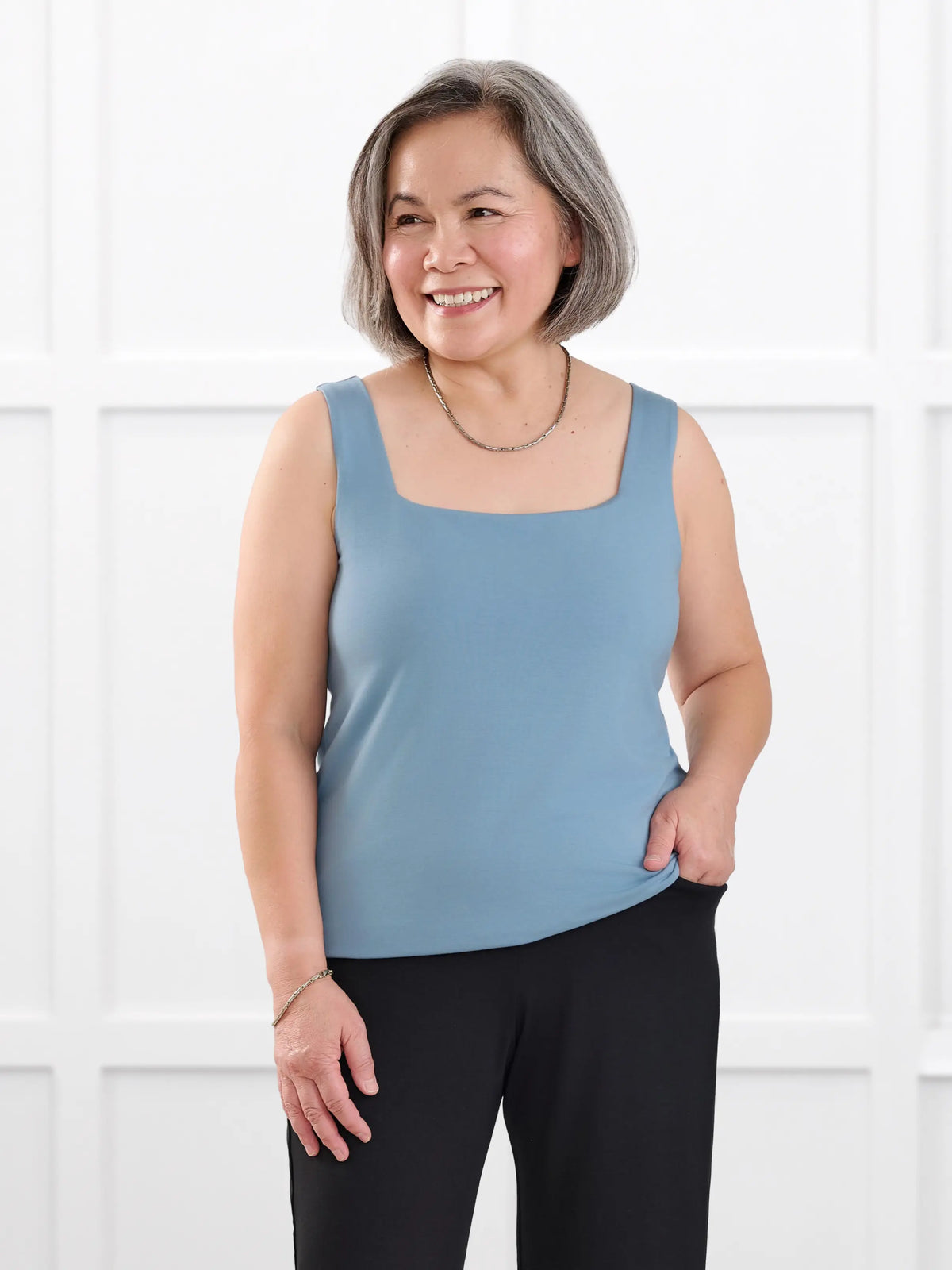 Eline reversible neckline shelf bra tank for women in Steel blue on model Terry, size S @Terry-S