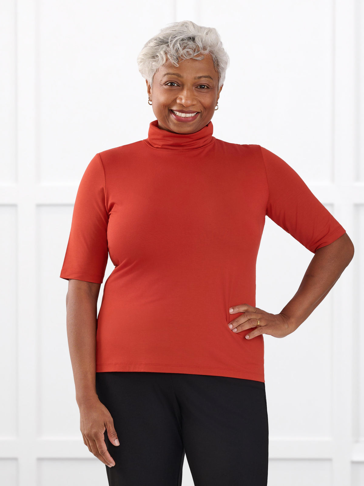 Halima half sleeve turtleneck top for women in Terracotta on model Keethai, size M @Keethai-M