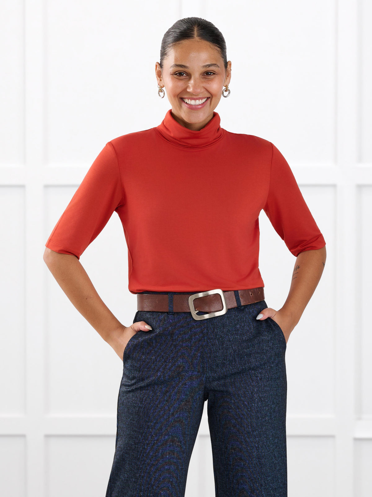 Halima half sleeve turtleneck top for women in Terracotta on model Meron, size XS @Meron-XS