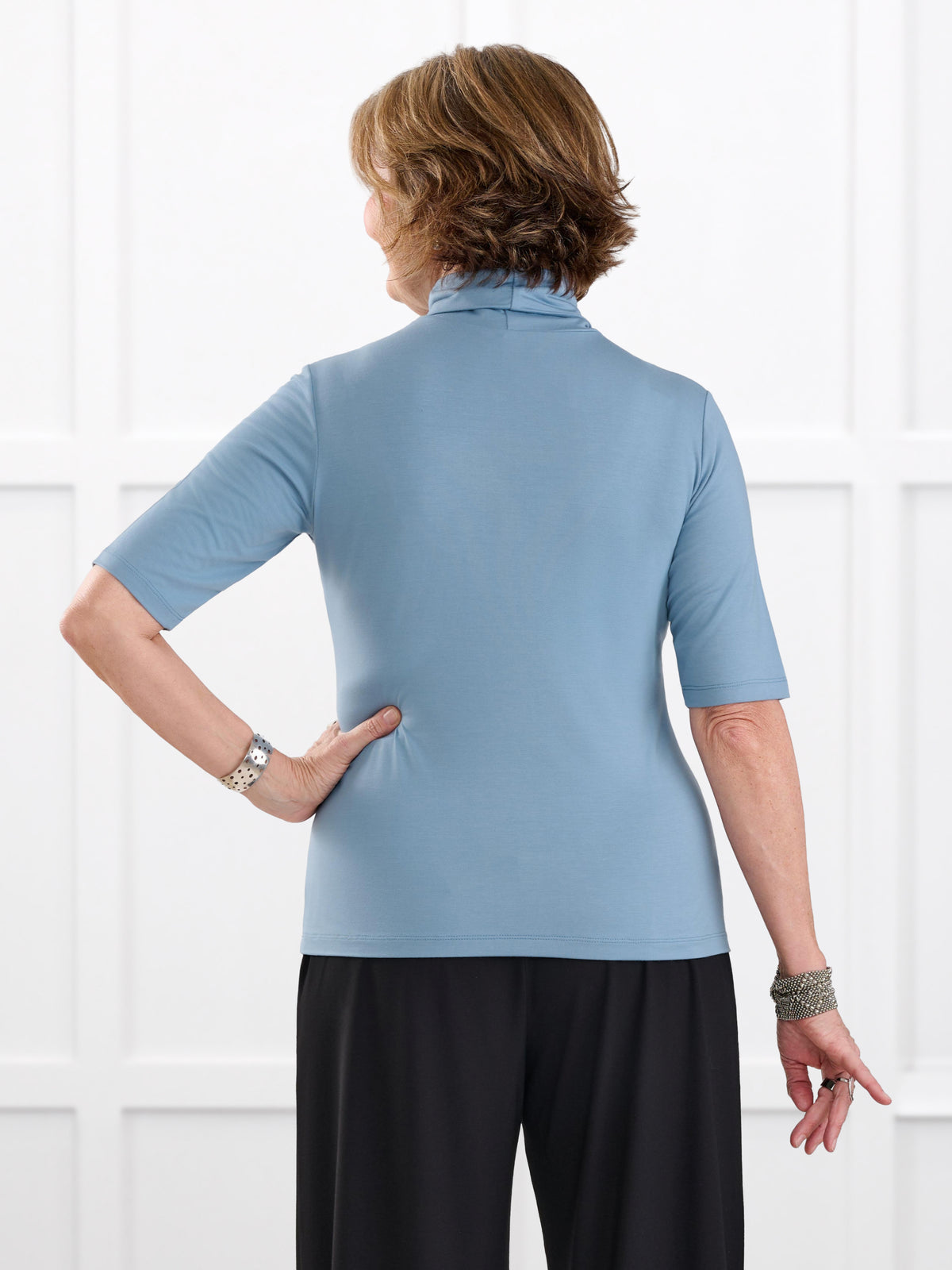 Halima half sleeve turtleneck top for women in Steel blue on model Donna, size S @Donna-S