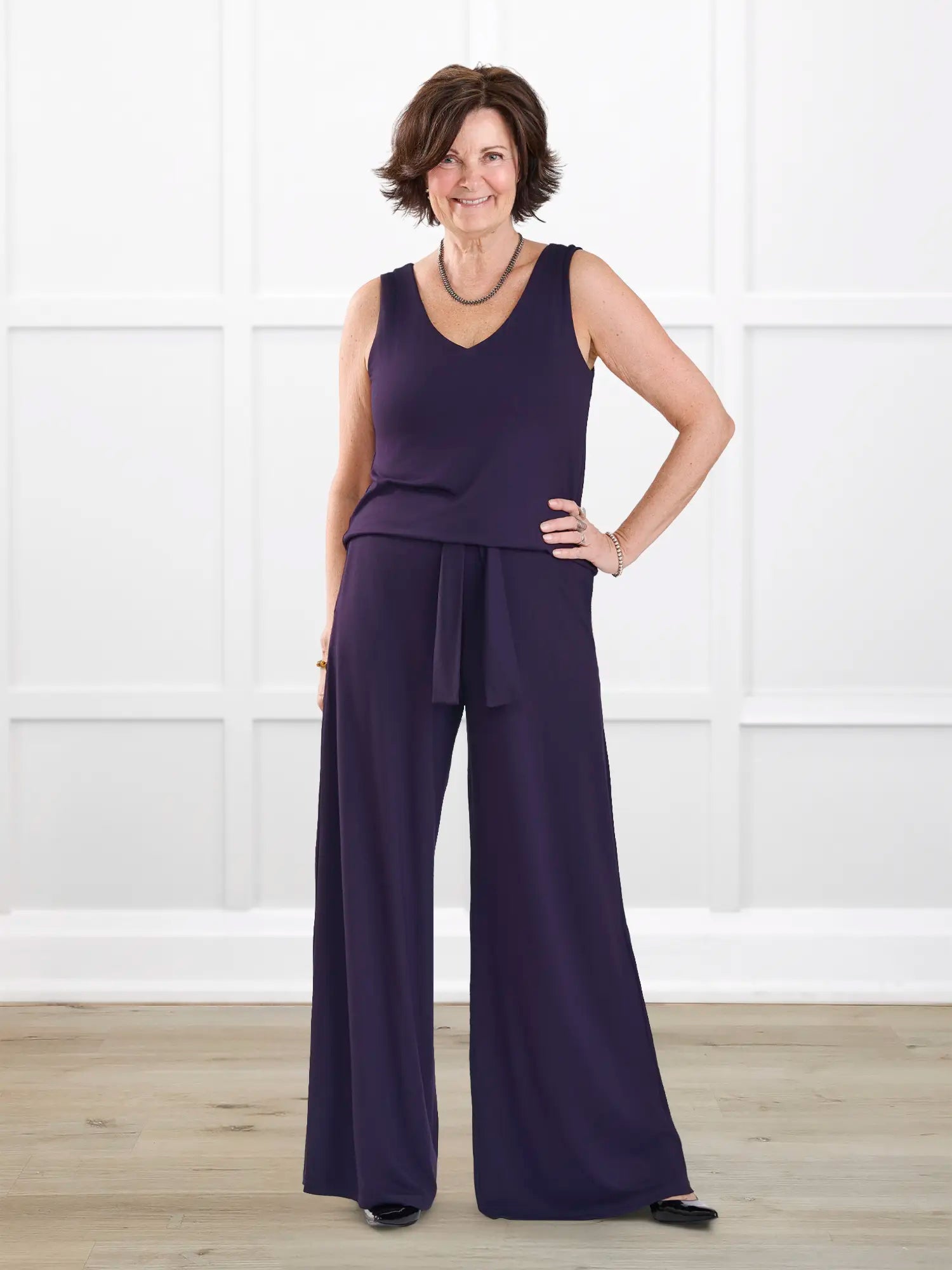 Janelle open back wide leg jumpsuit for women in Aubergine on model Donna, size S Regular @Donna-S-regular