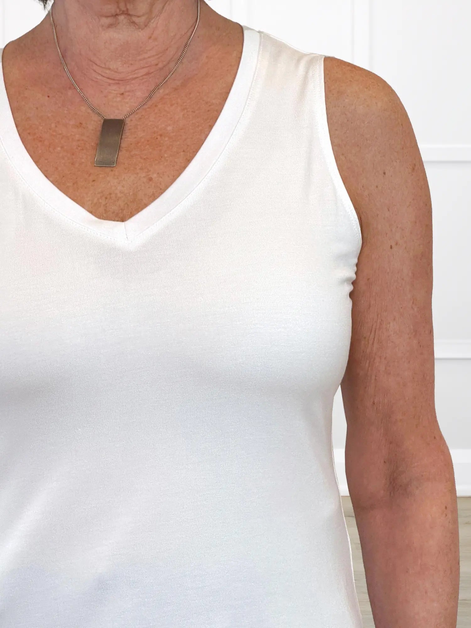Jules v neck sleeveless top for women in White fabric irregular