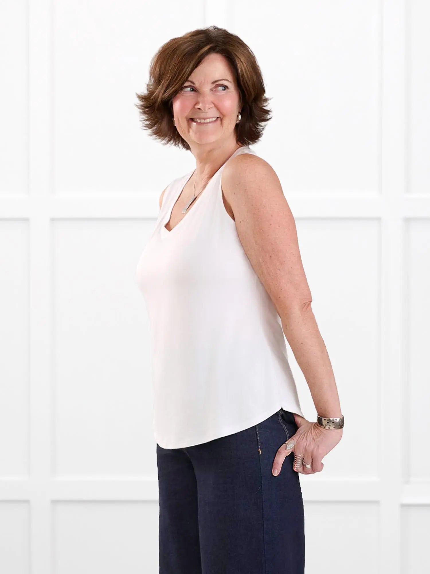 Jules v neck sleeveless top for women in White fabric irregular on model Donna, size S @Donna-S