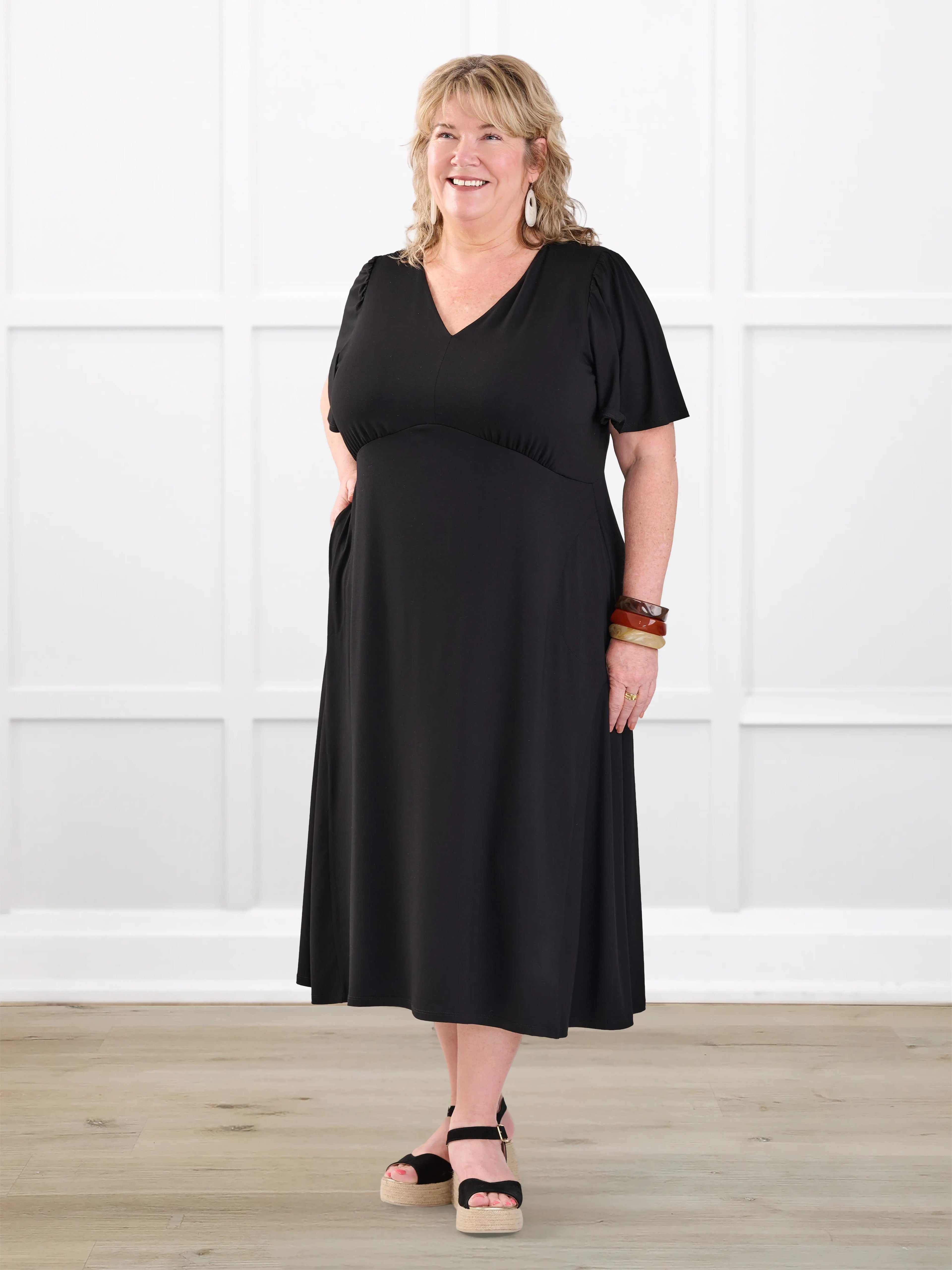 Juliana flutter sleeve midi dress for women in Black on model Kelly, size 3X @Kelly-3x