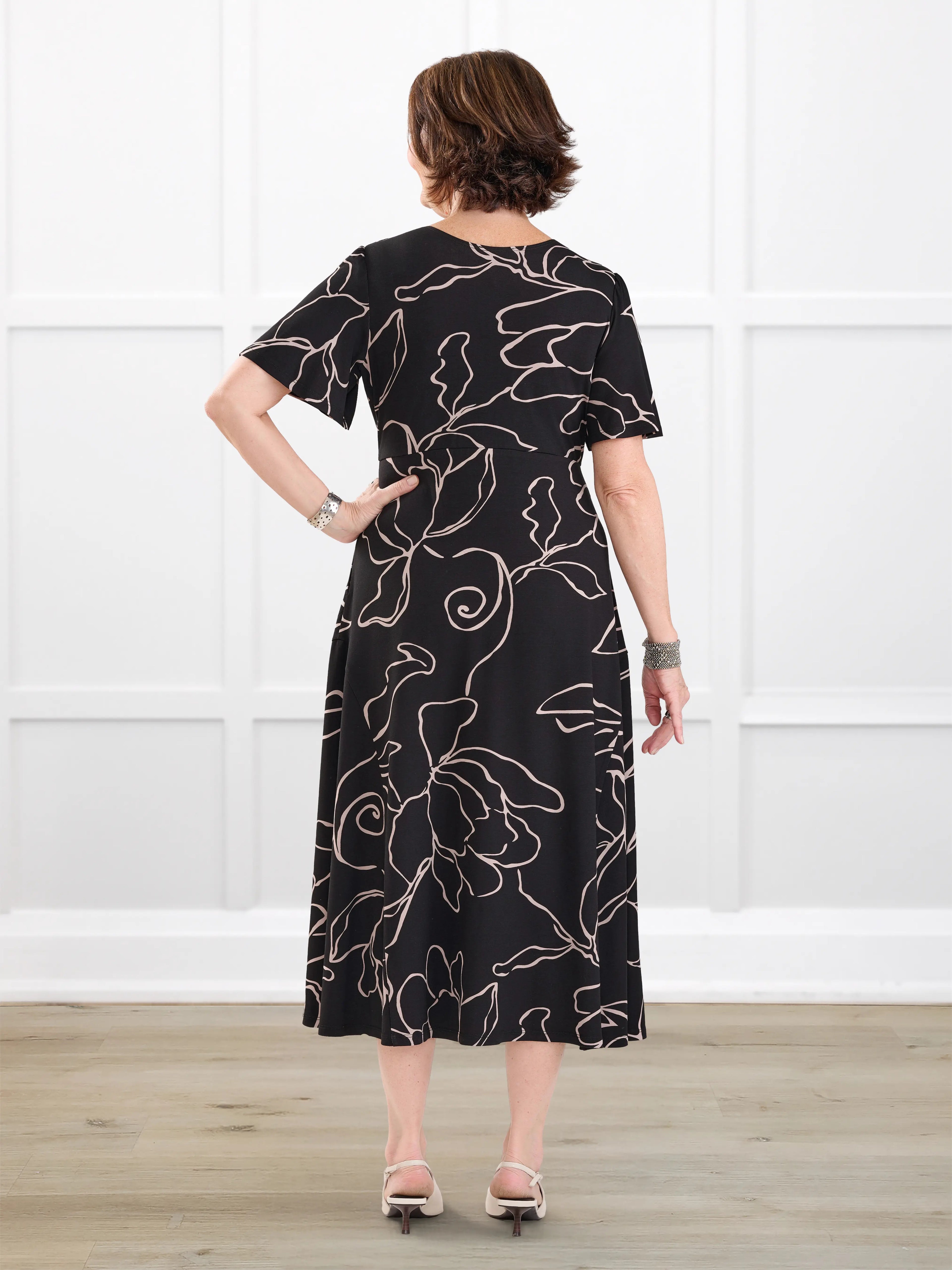 Juliana flutter sleeve midi dress for women in Contour floral on model Donna, size S Regular @Donna-S-regular