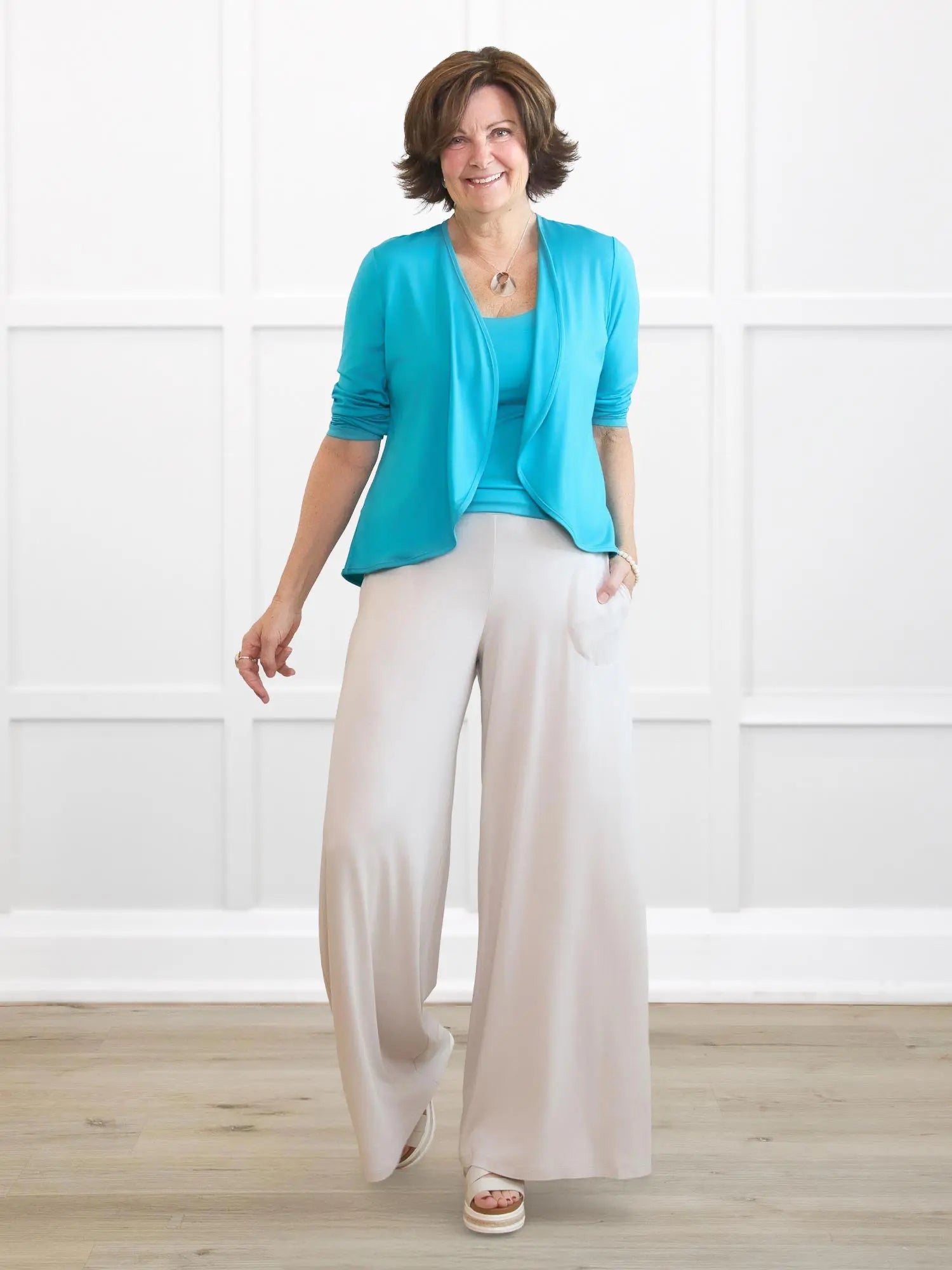 Kaleo high waisted wide leg pant for women in Sandstone on model Donna, size S Regular @Donna-S-regular