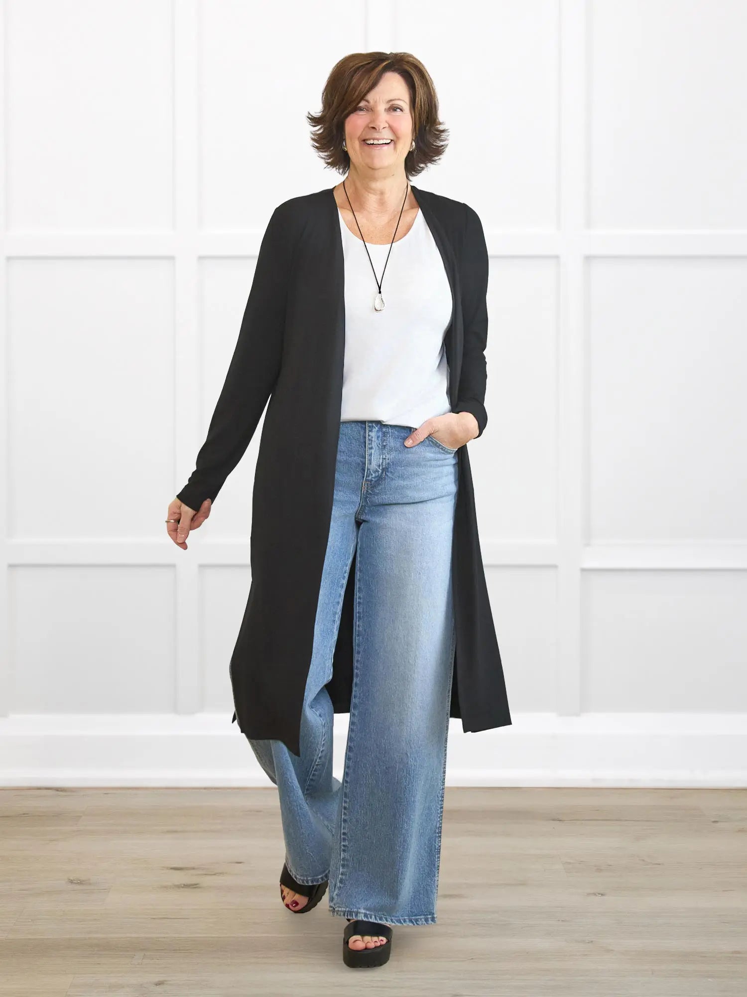 Larissa duster cardigan with pockets for women in Black on model Donna, size S Regular @Donna-S-regular