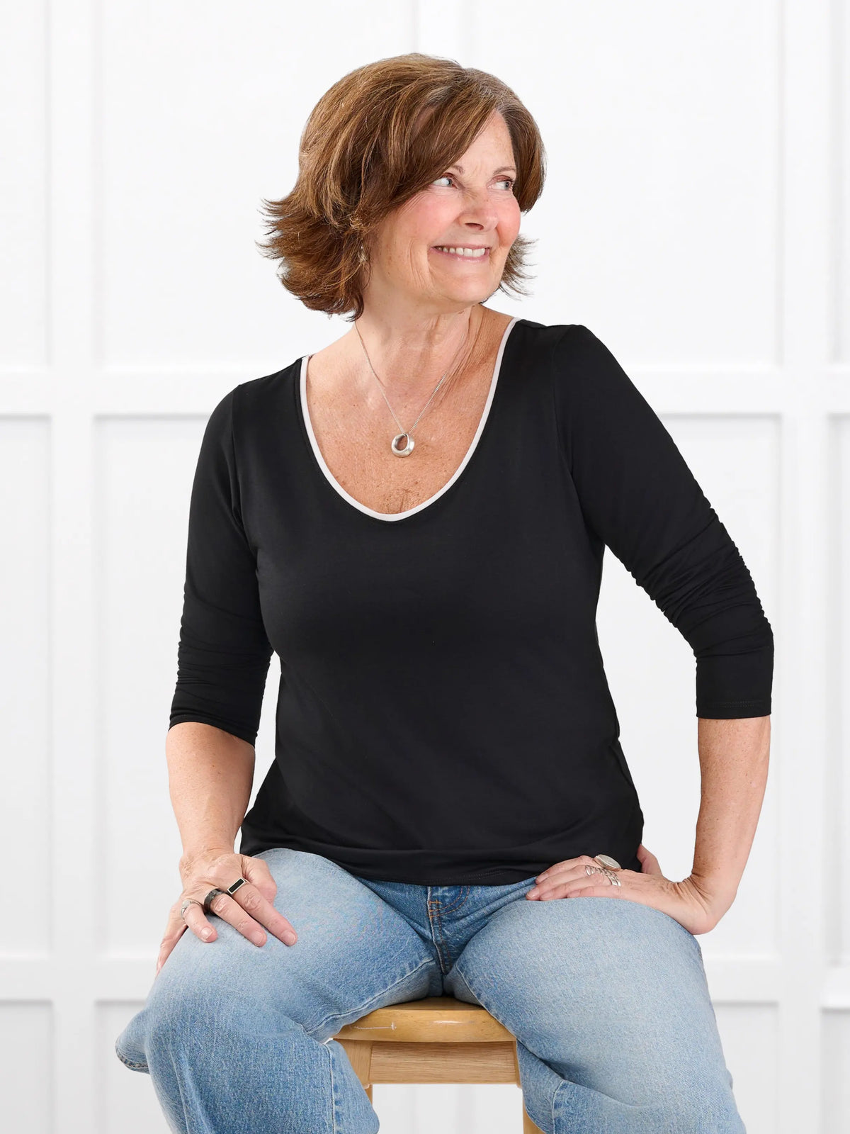 Liv v neck long sleeve top for women in Black white on model Donna, size S Regular @Donna-S-regular