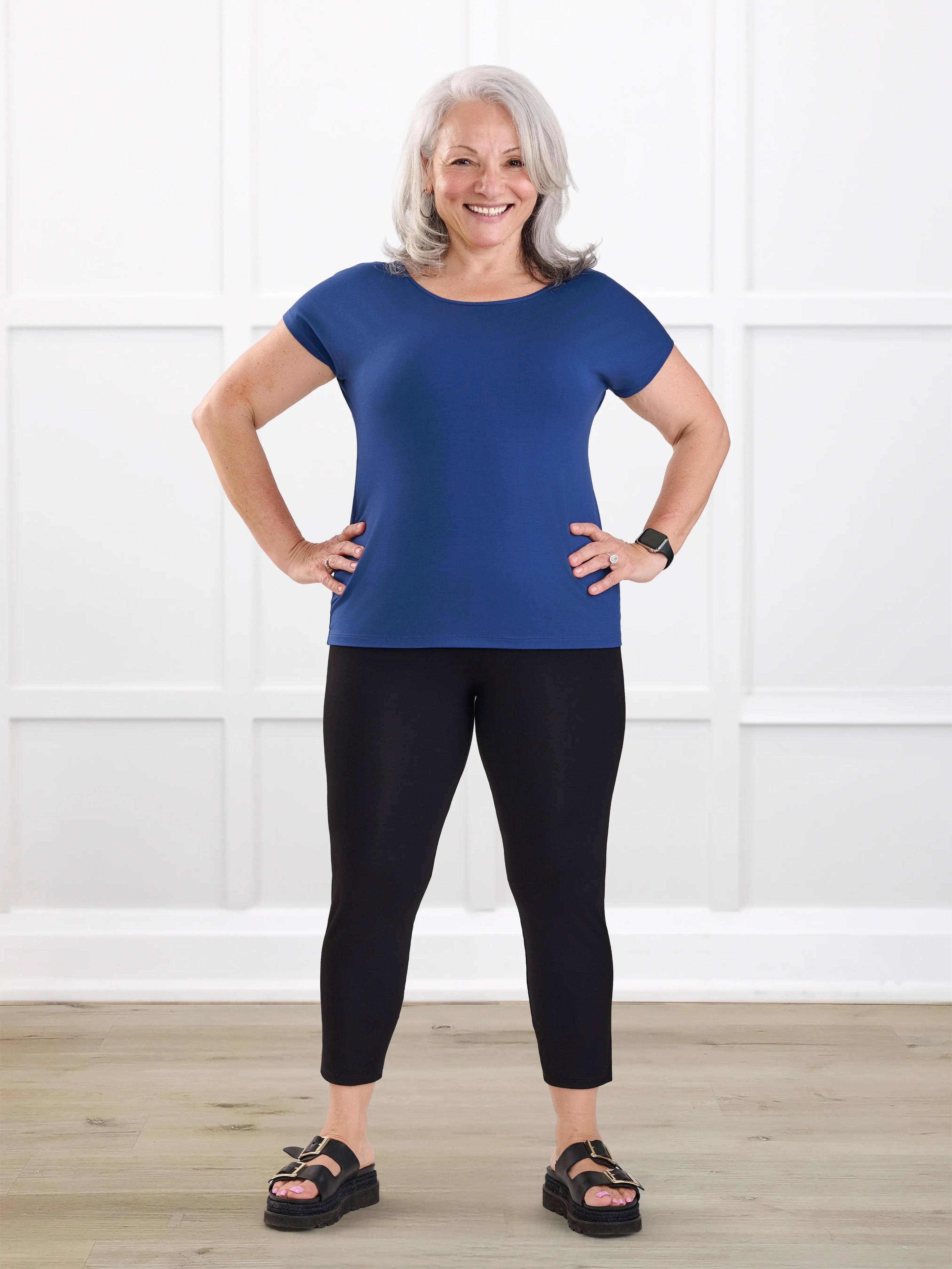 Lucy mid rise capri legging for women in Black on model Rula, size L @Rula-L