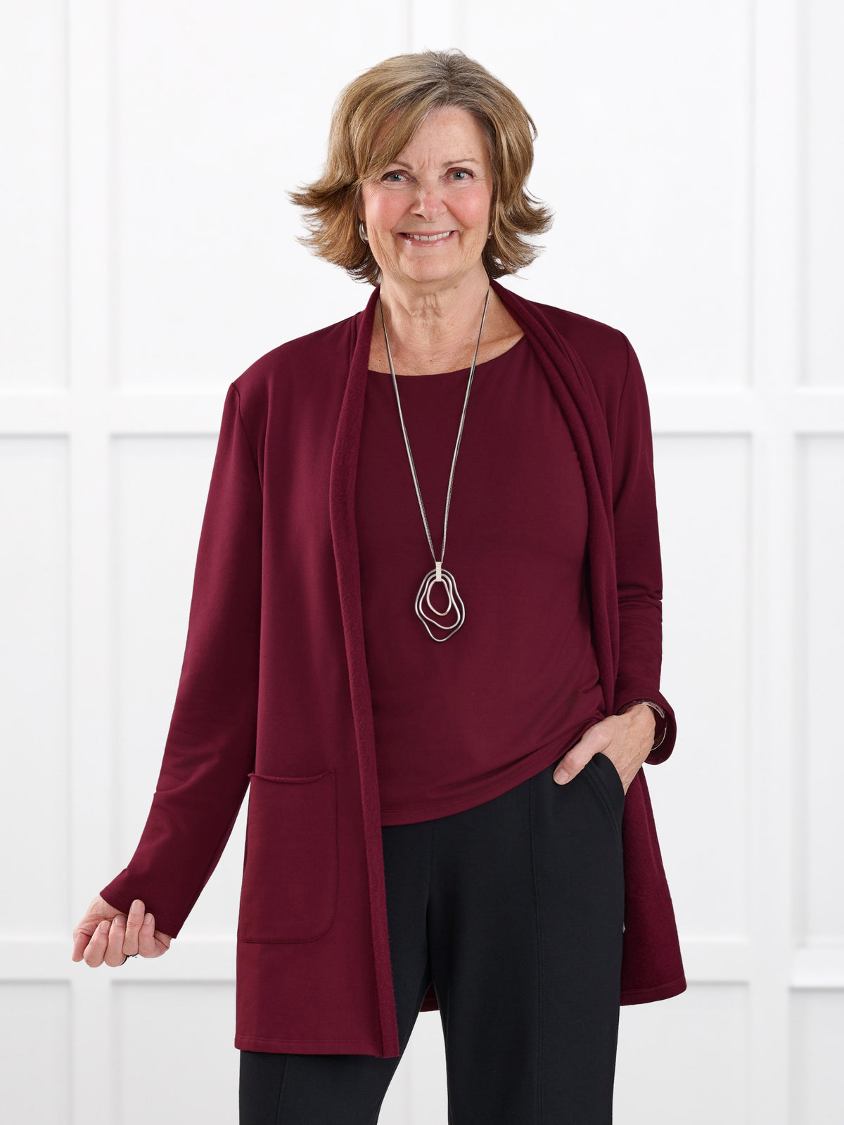 Montana fleece pocket cardigan for women in Merlot on model Donna, size S Regular @Donna-S-regular