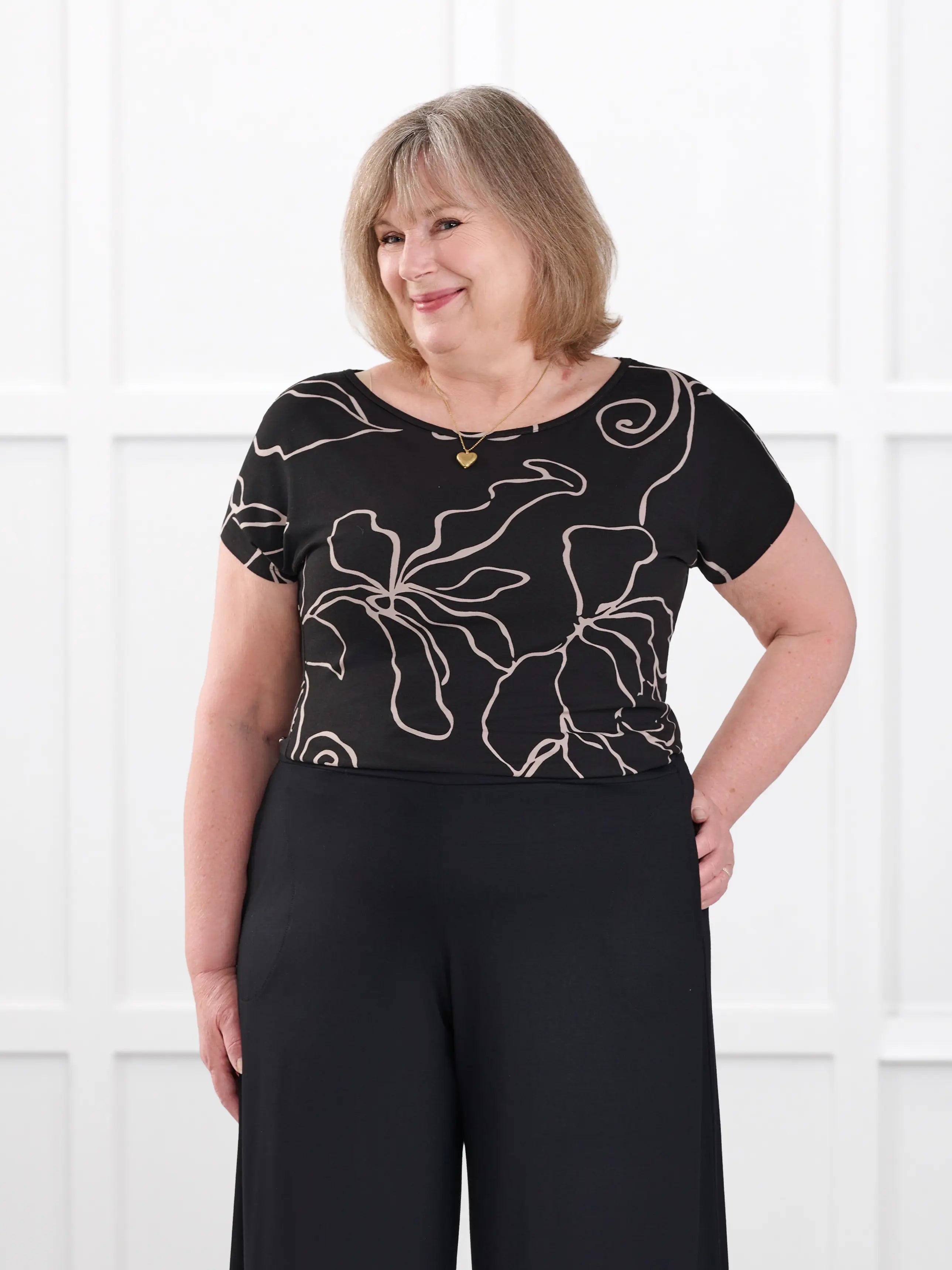 Rio reversible neckline dolman tee in Contour floral on model Laurie, size XXL @Laurie-XXL
