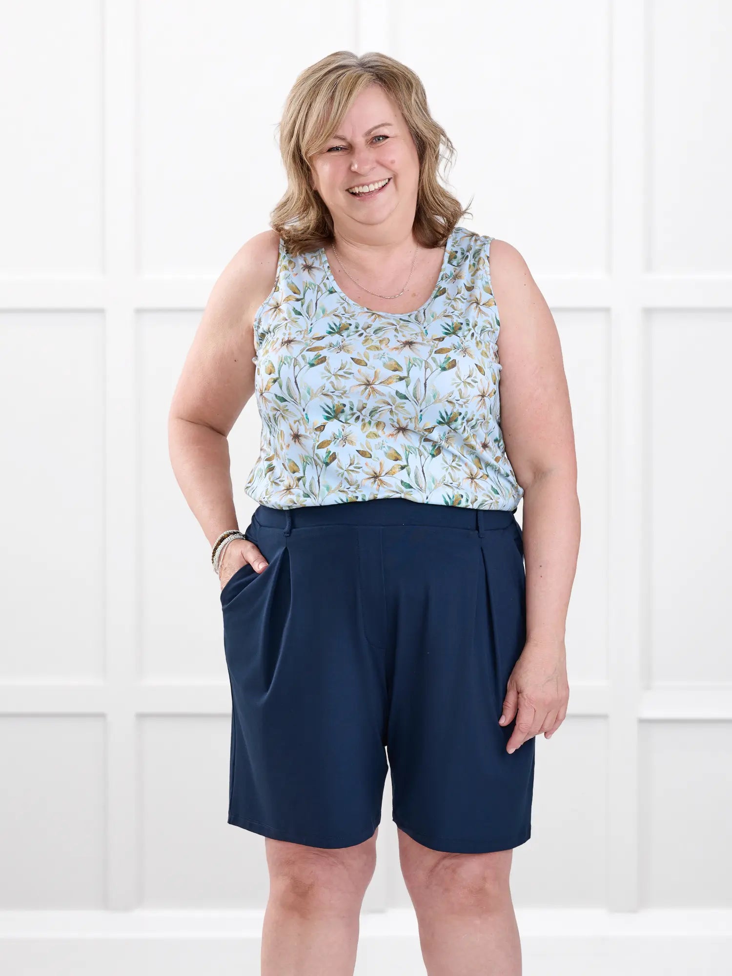 Saleema tailored pleated short for women in Navy on model Deb, size XL @Deb-XL