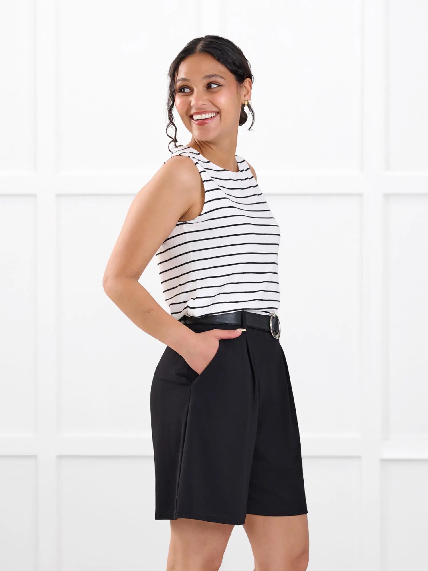 Saleema tailored pleated short for women in Black on model Meron, size XS @Meron-XS