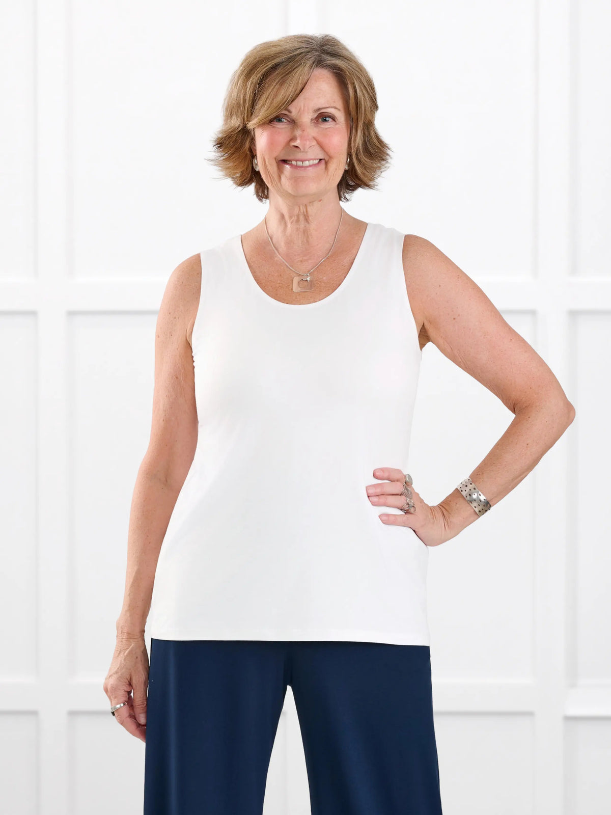 Shandra reversible neckline tank top in White on model Donna, size S Regular @Donna-S-regular