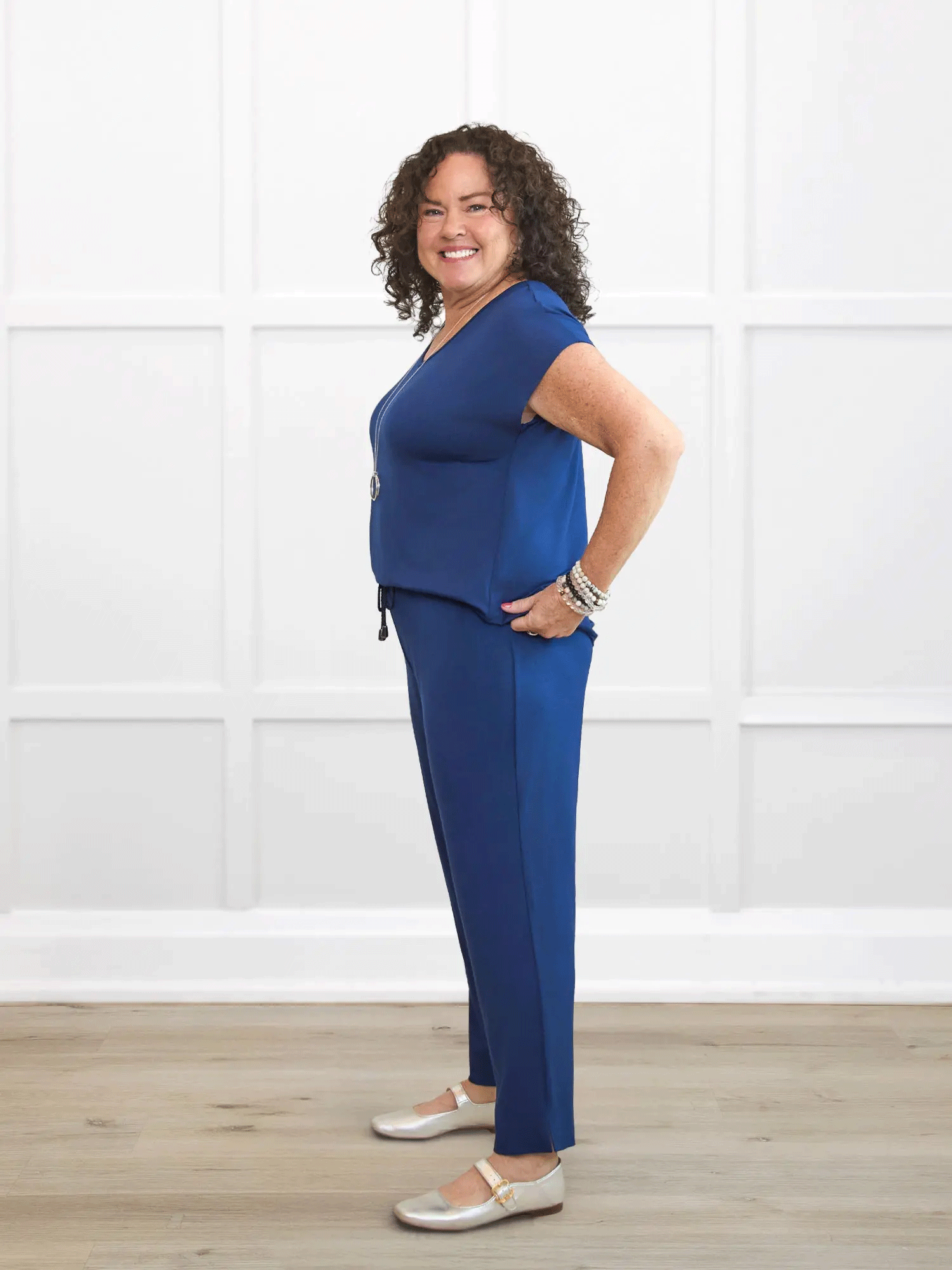 Stef v neck open back capri jumpsuit for women in Marine blue on model Kerri, size M @Kerri-M