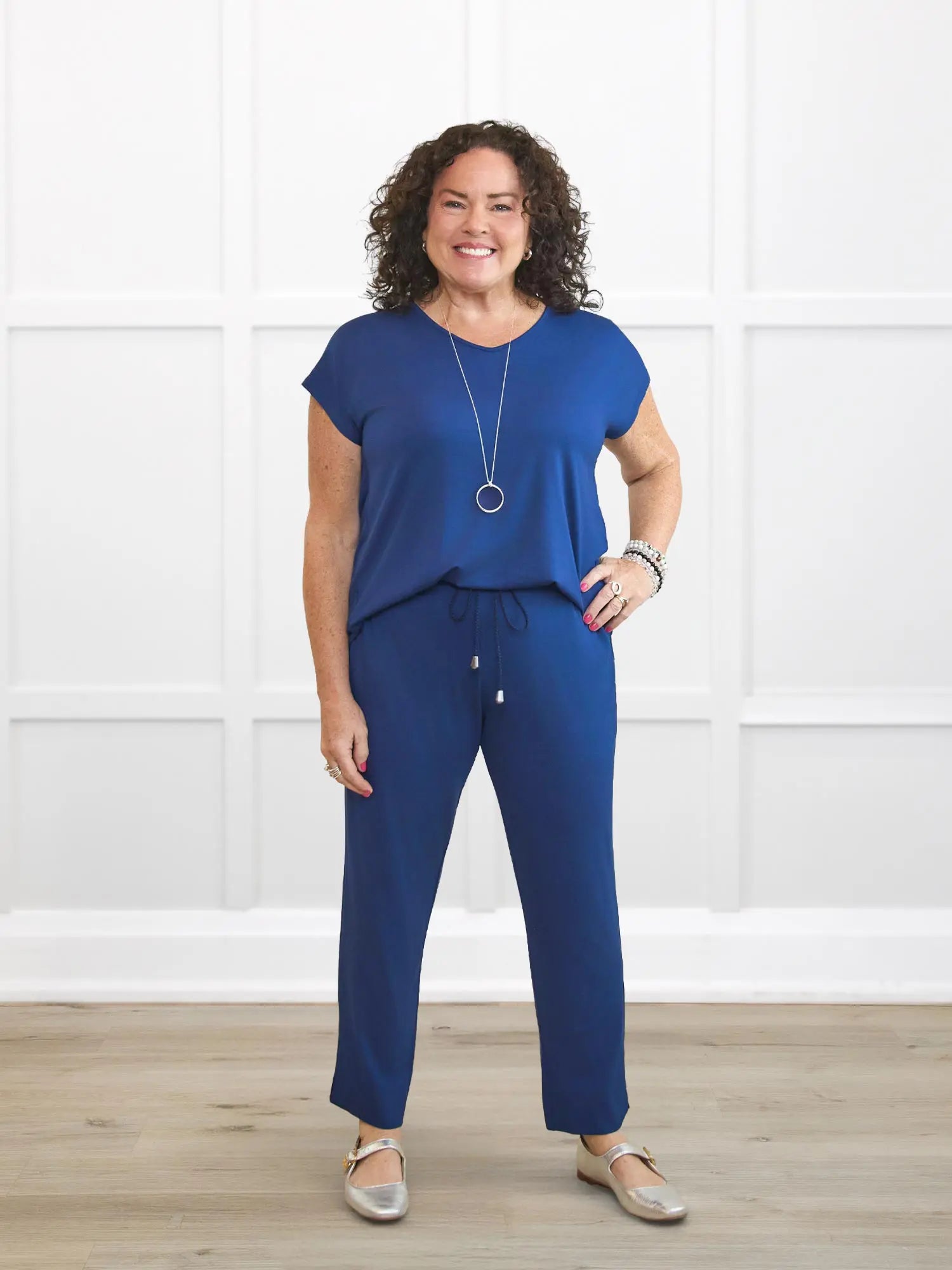 Stef v neck open back capri jumpsuit for women in Marine blue on model Kerri, size M @Kerri-M