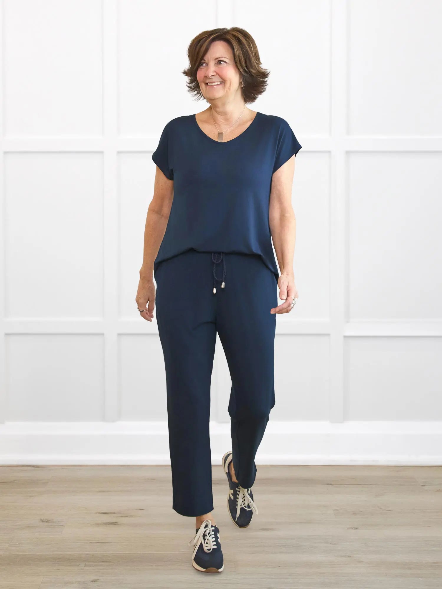 Stef v neck open back capri jumpsuit for women in Navy on model Donna, size S @Donna-S