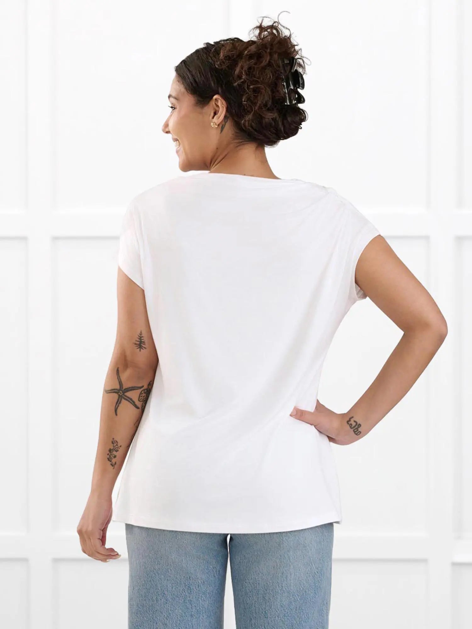 Yuna draped reversible neckline top for women in White on model Meron, size XS @Meron-XS