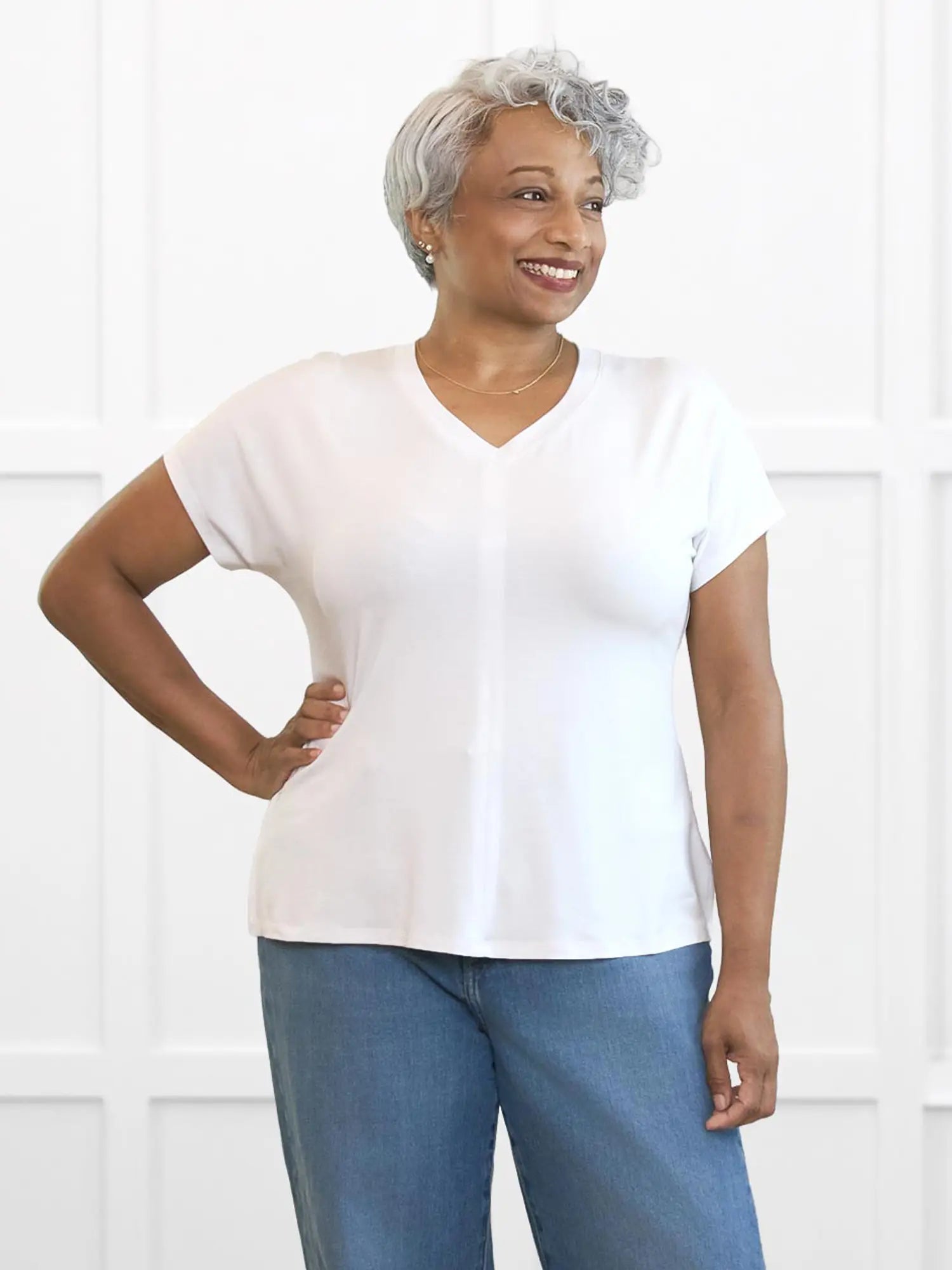 Zyla v neck dolman top for women in White on model Keethai, size M @Keethai-M