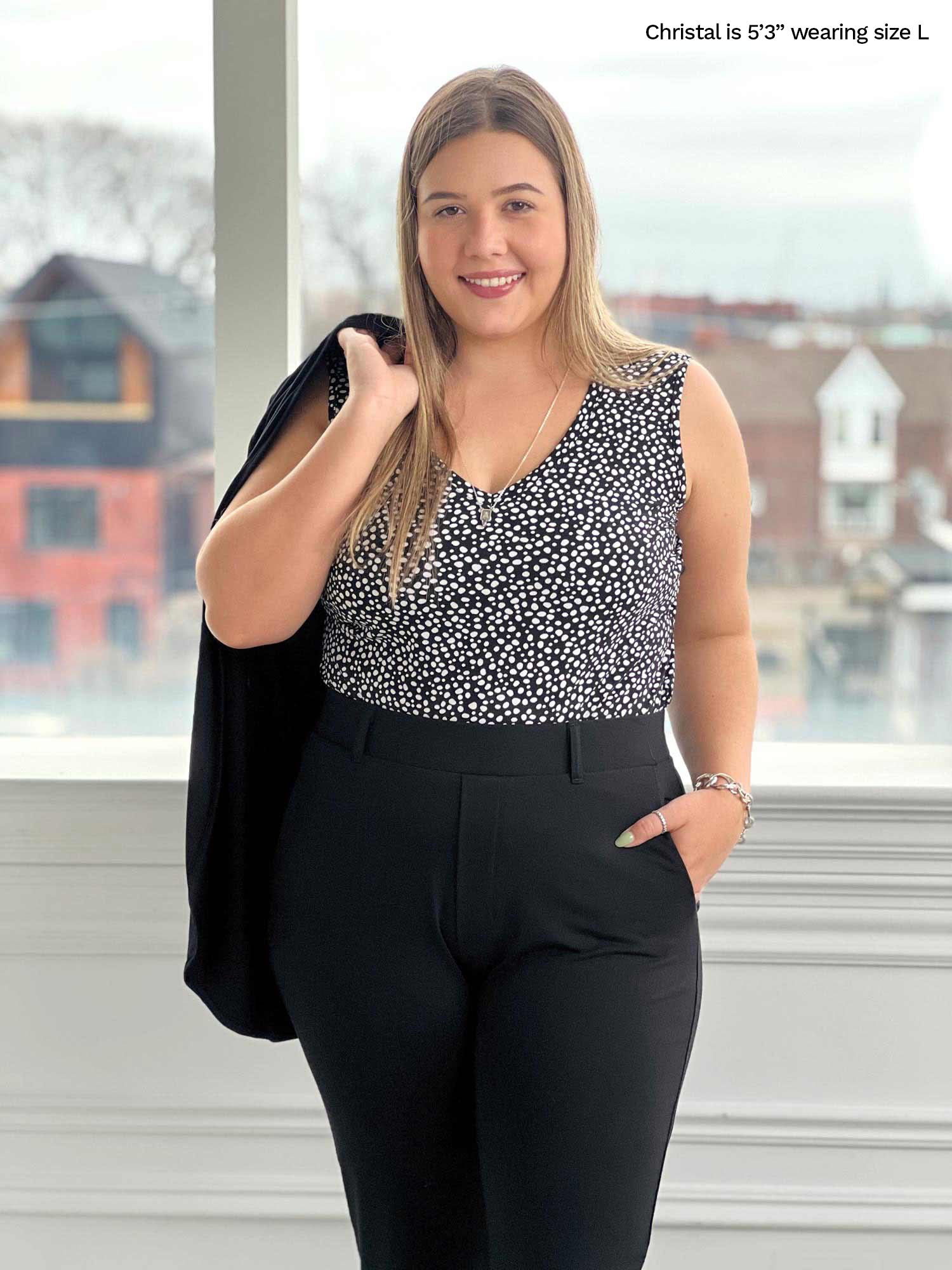 Woman standing in front of a window wearing Miik&
